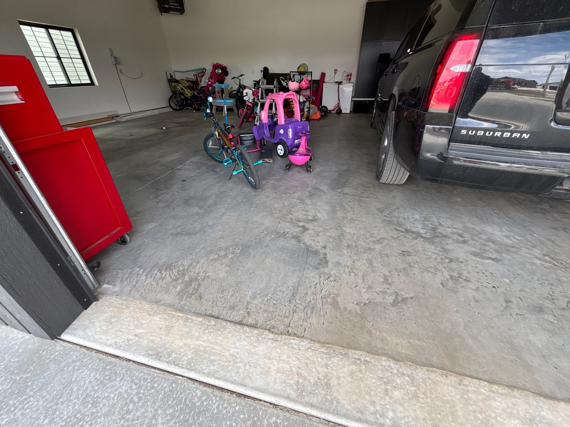 Custom Speckled Concrete Coating for Dell Rapids Garage by Select Painting, Coatings & Garage Cabinets