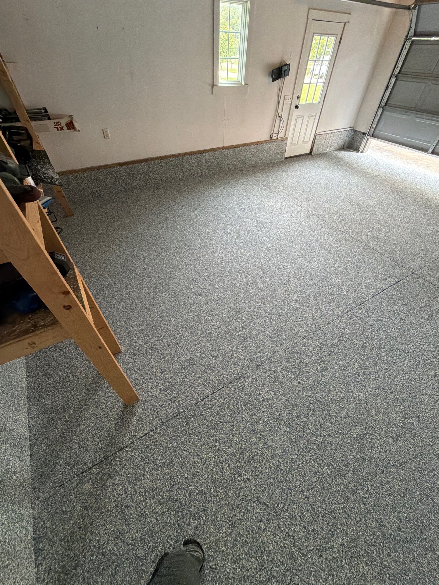 Custom Tidal Wave Epoxy Flake Floor Installation in Norton Shores. by Gordon Painting