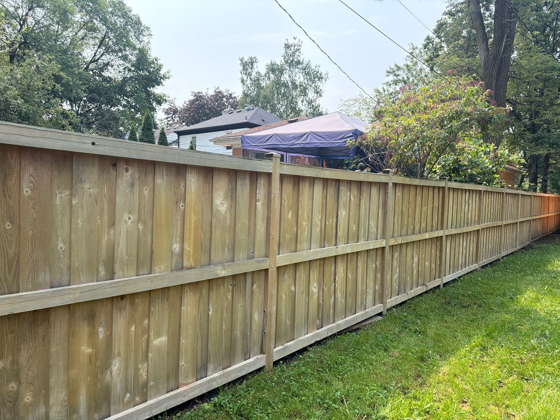 Wood fence cleaning and sealing by Northern Power Washing LLC.
