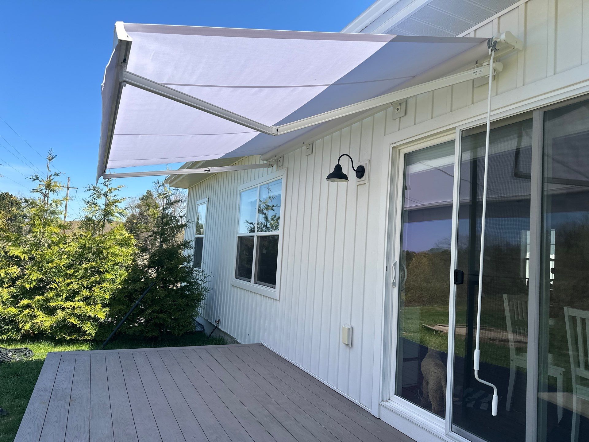 Sunesta Retractable Awning Installation for Traverse City Composite Deck by Rainbow Seamless Systems