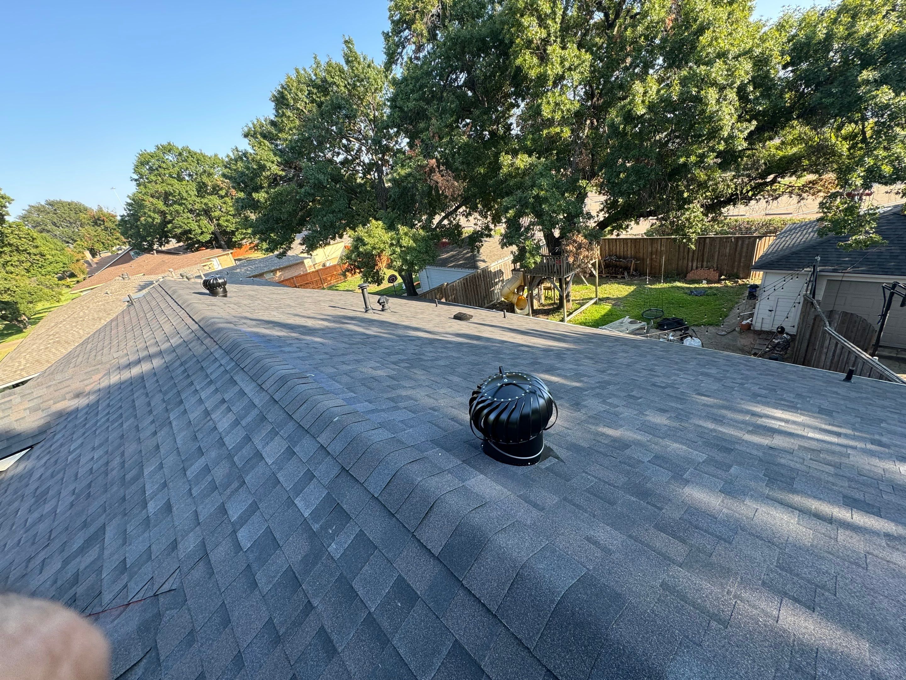 IKO Glacier-White brick house by Tejas Roofworks + Restoration