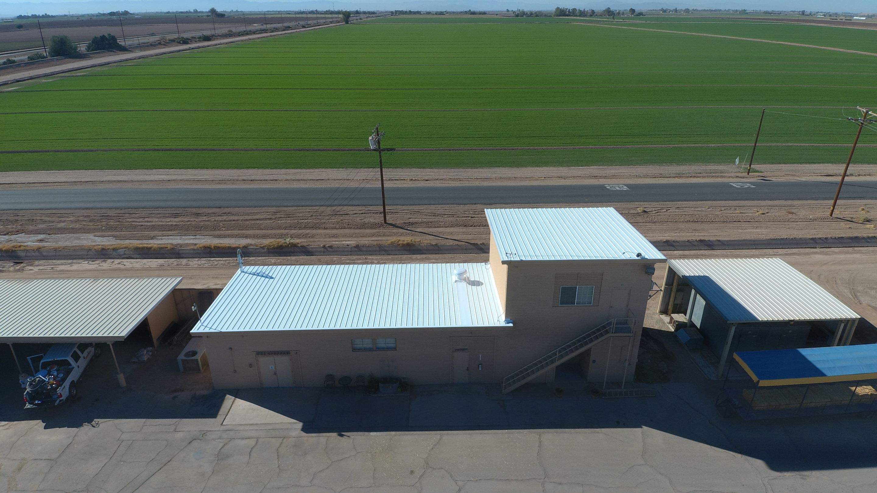 Metal roof restoration on commercial roof using Conklin Benchmark/PUMA XL fabric and coating by Straight Edge Roofing Inc