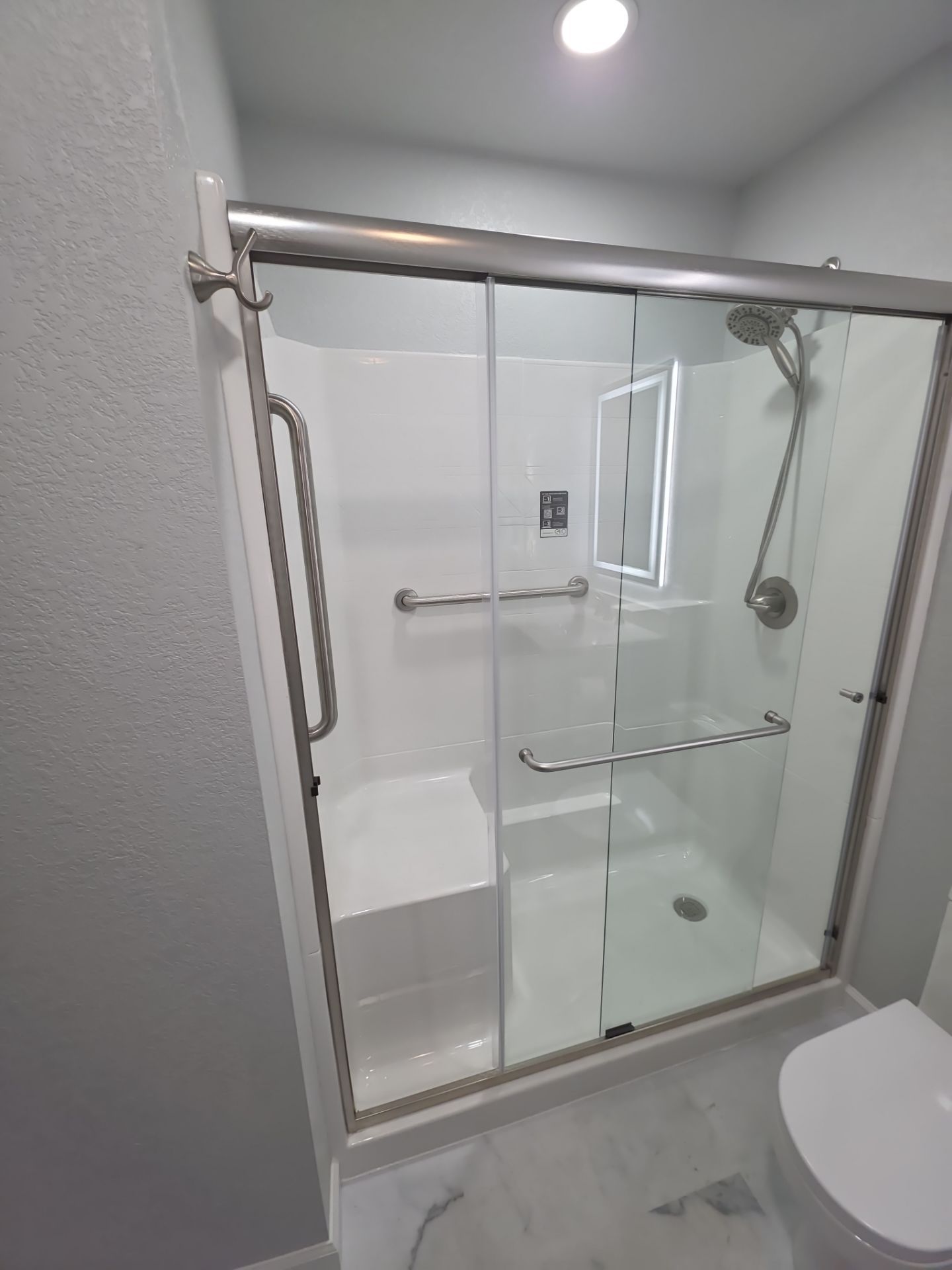 Bathroom remodel by In & Out Construction & Remodeling, LLC