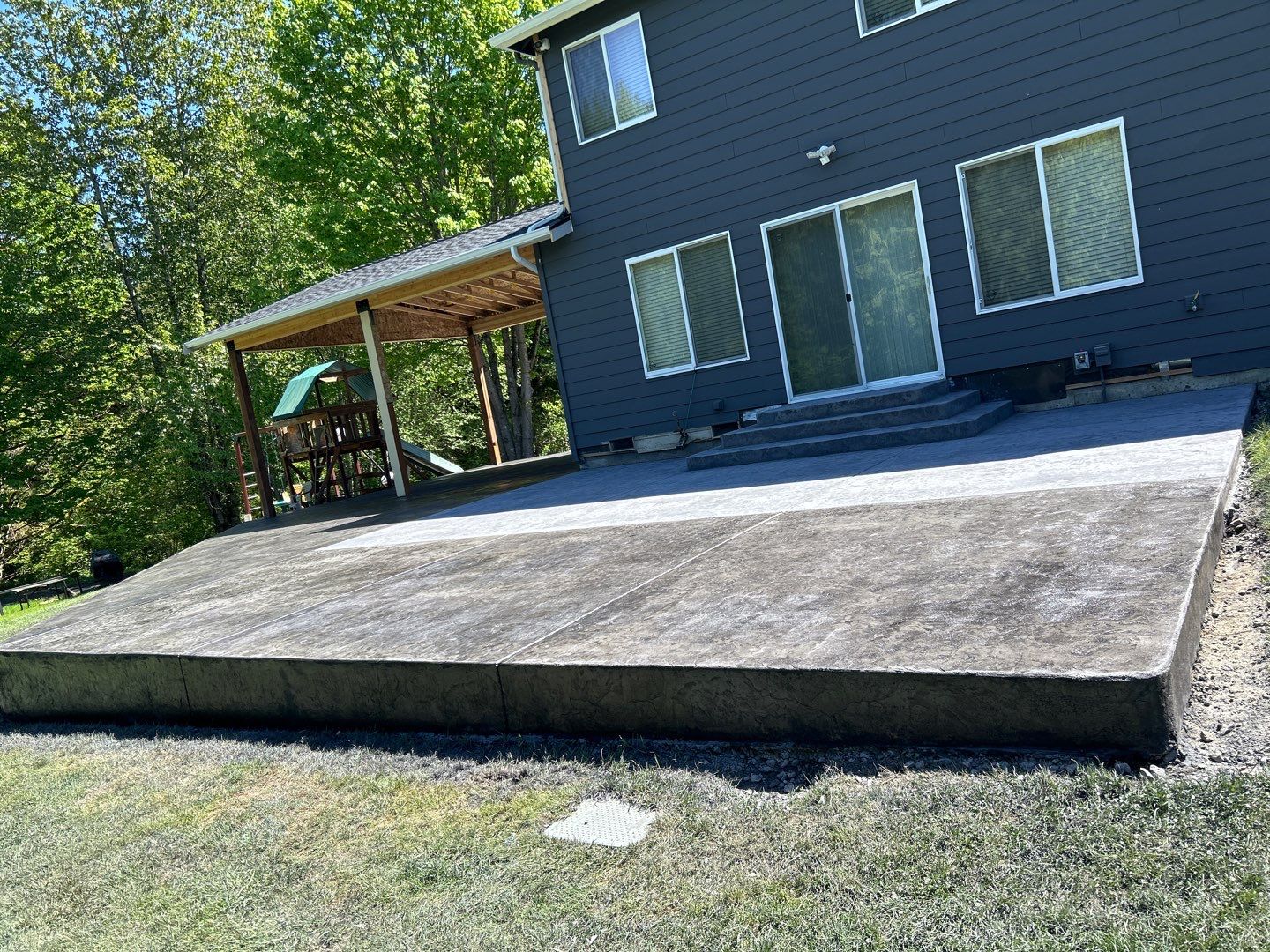 Ty | Concrete Patio by Jireh Asphalt & Concrete Inc 