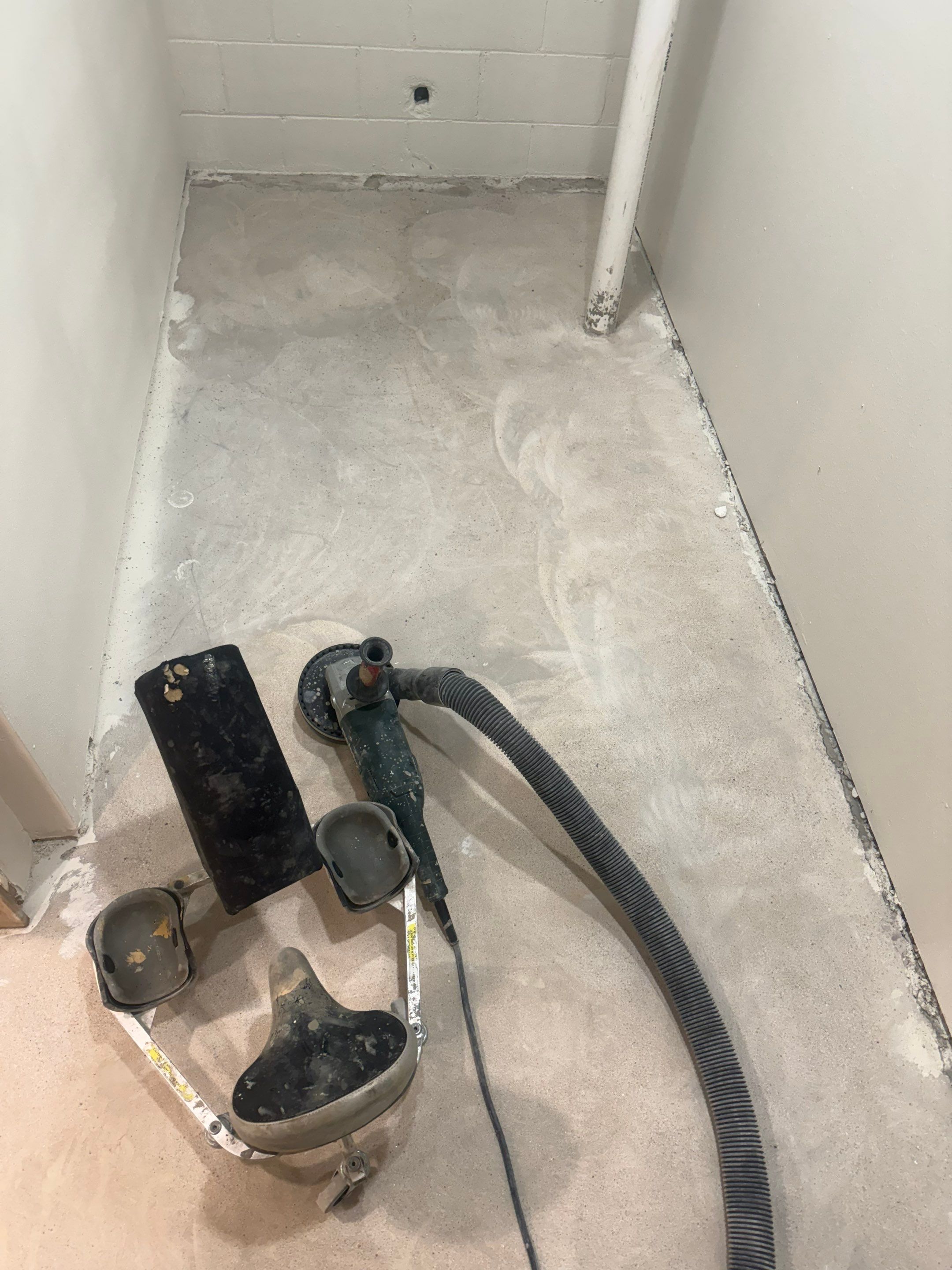 High-Gloss Epoxy Floor Coating and Basement Renovation in Rock Rapids by Select Painting, Coatings & Garage Cabinets