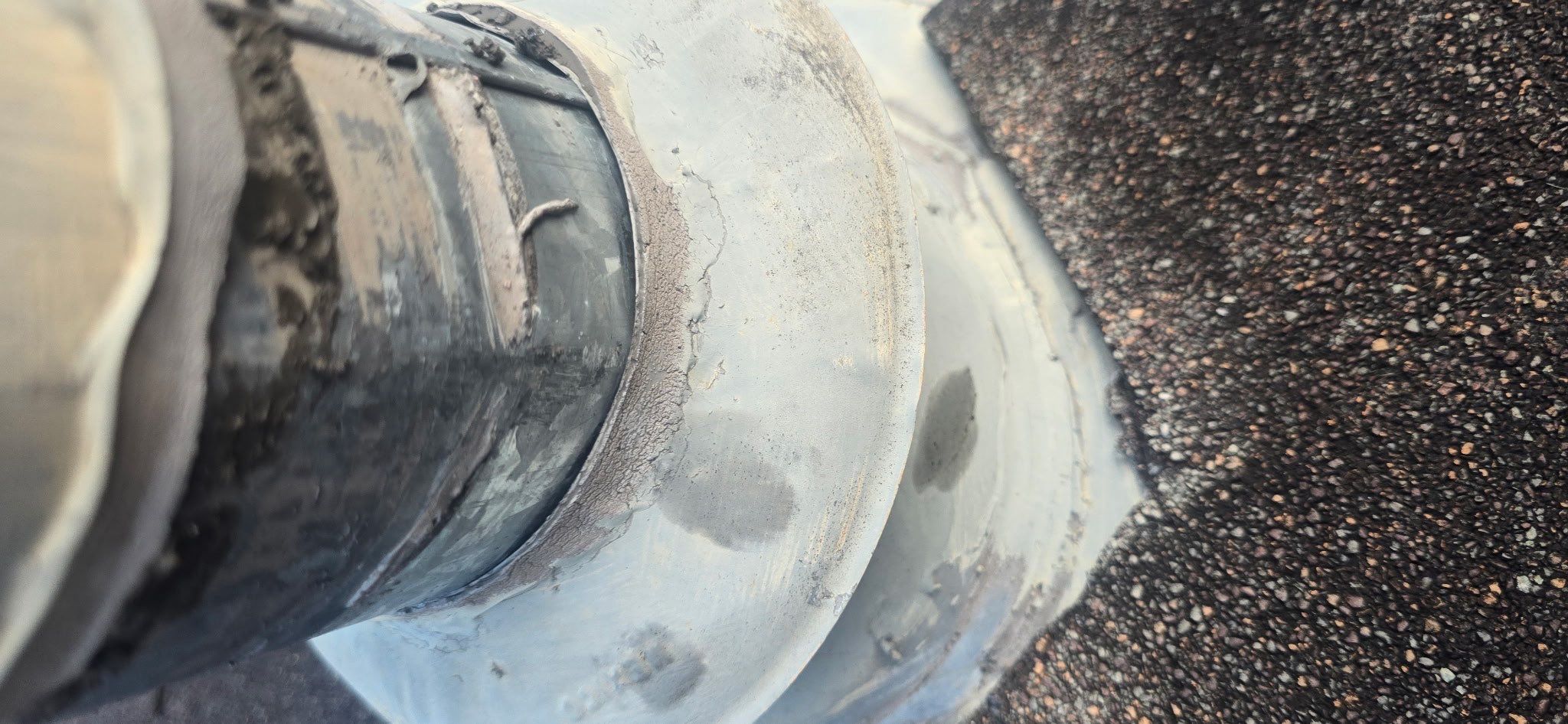 Water Heater Vent Collar Reseal by Black Coast Roofing