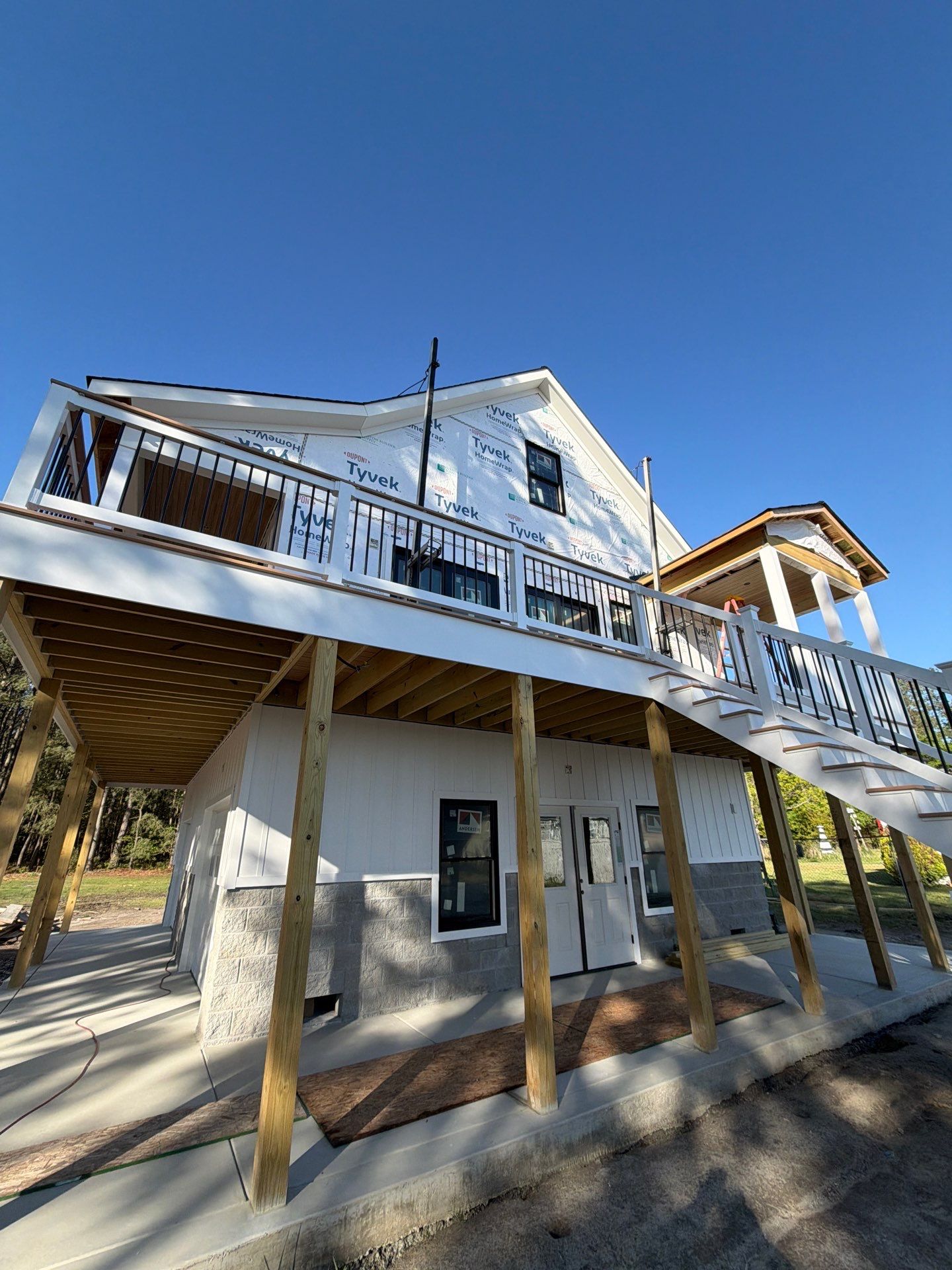 Two-Story Custom Home With Board and Batten Siding by Cade Construction