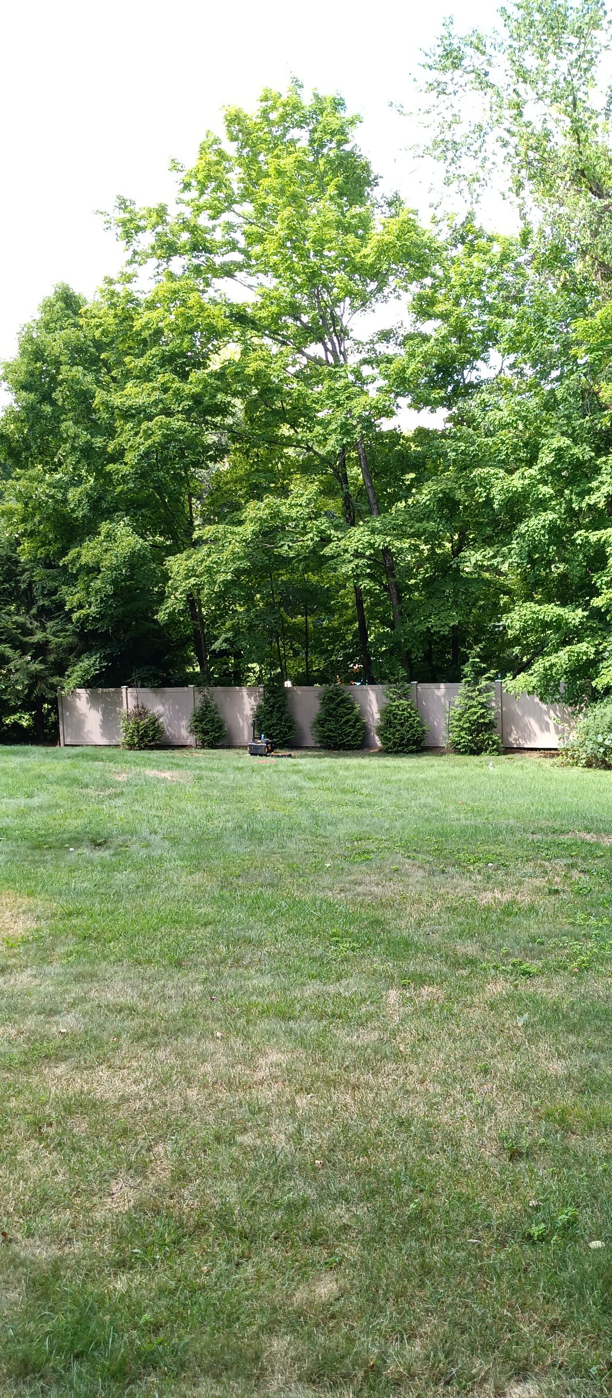 New Vinyl Privacy fence in Classic Clay by DiGiorgi Roofing and Siding Inc