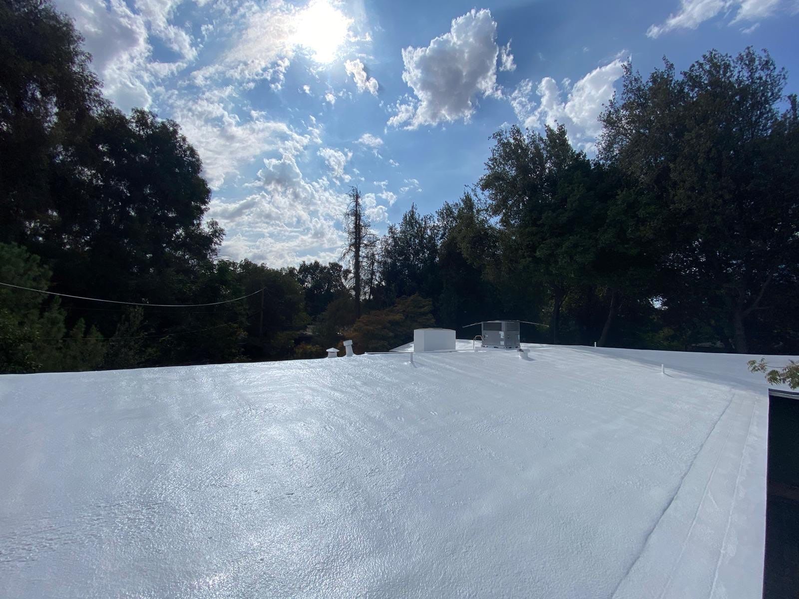 New spray insulation roof over tar and gravel with coatings by Straight Edge Roofing Inc
