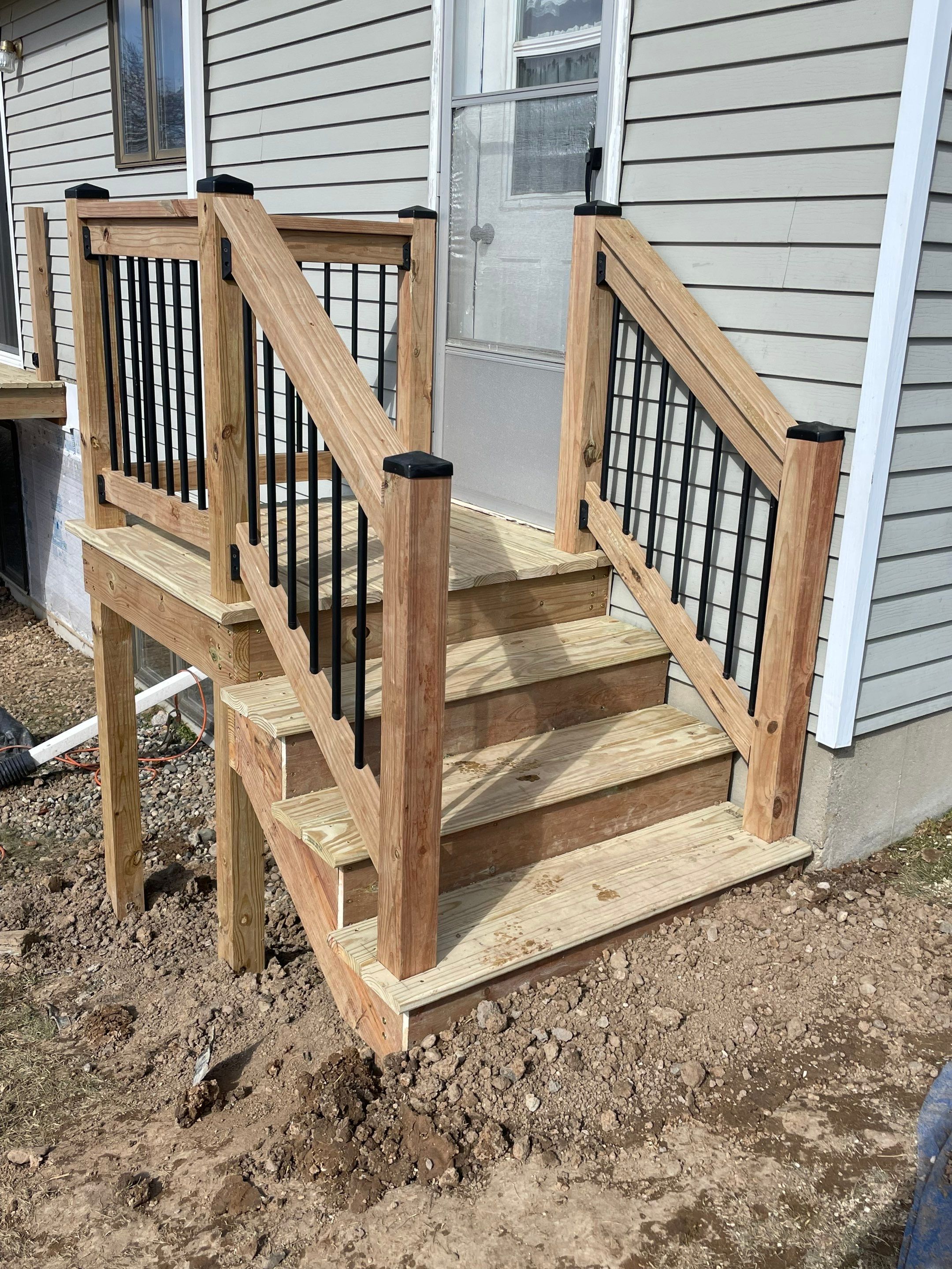 Deck Installation using Treated Lumber by Avalon Roofing and Exteriors