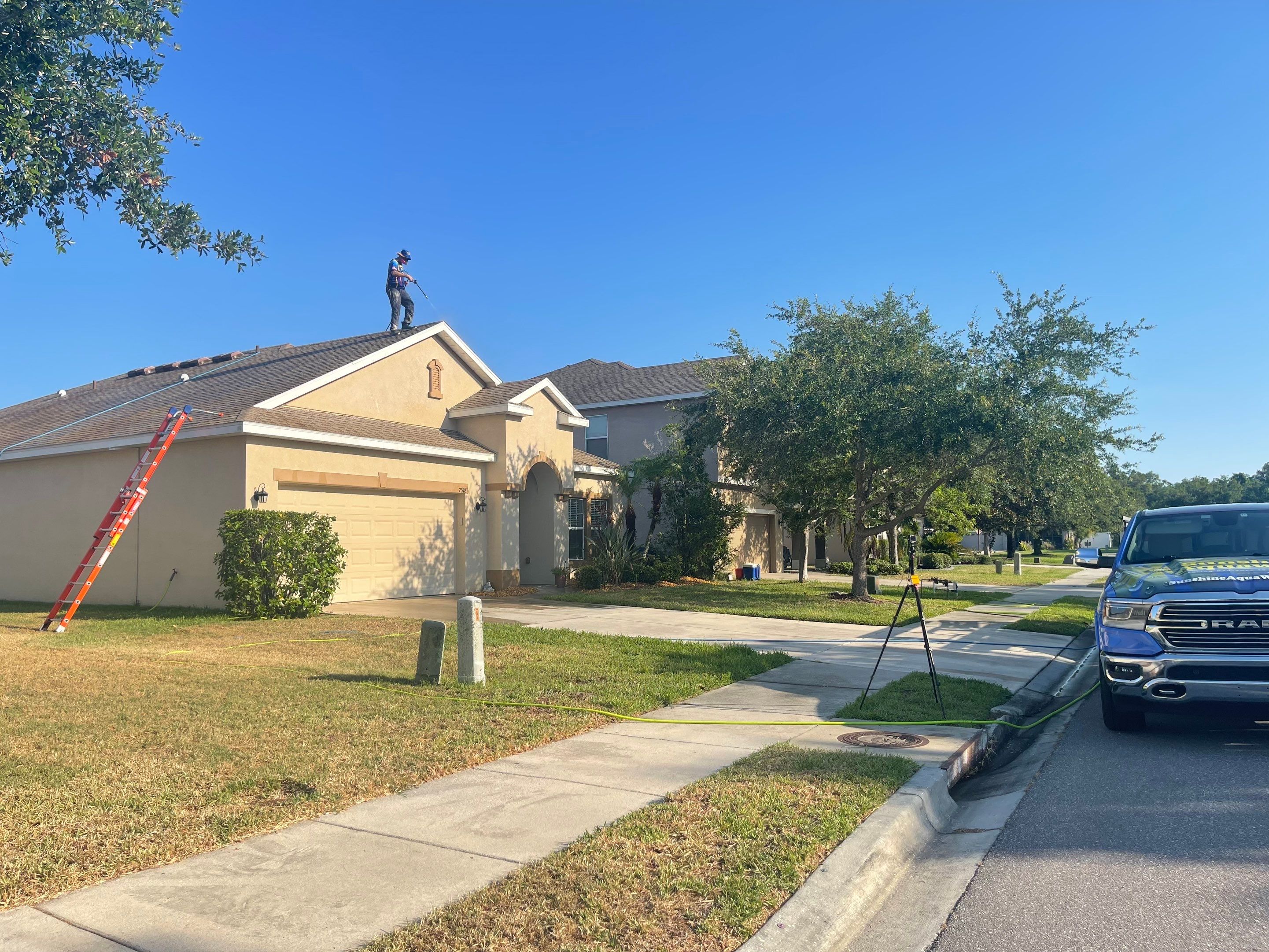 Asphalt Shingle Roof Soft Wash Cleaning & Concrete Pressure Washing in CopperStone Community, Parrish, FL by Sunshine AquaWash
