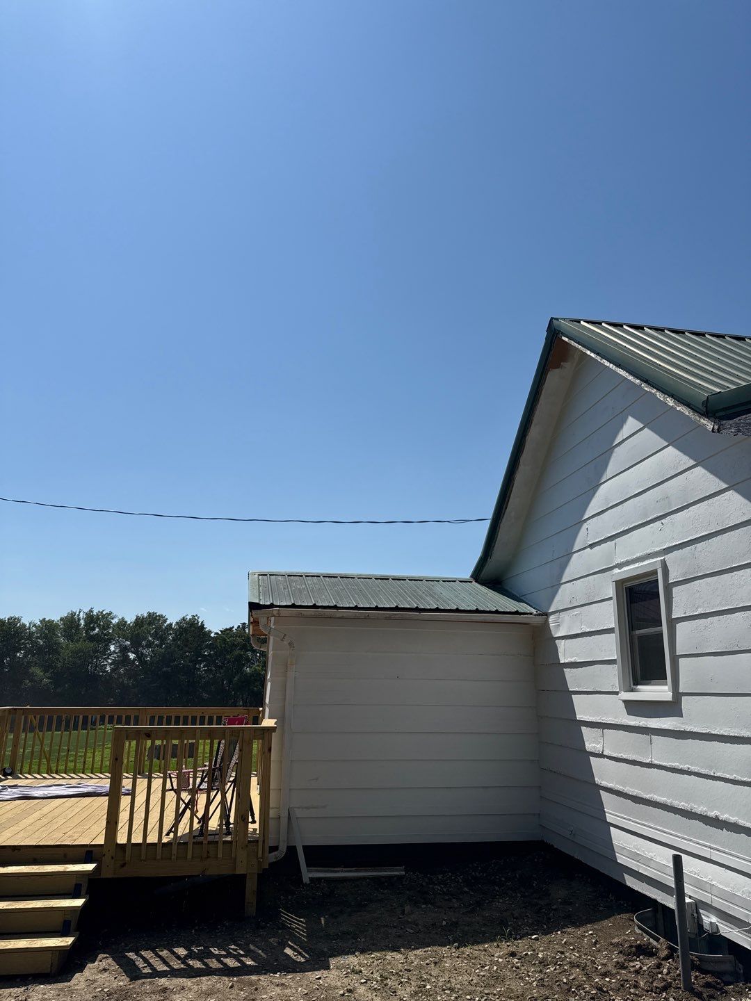 Standing-Seam Metal Roof and Vinyl Siding in Pender, NE by Crows Roofing LLC