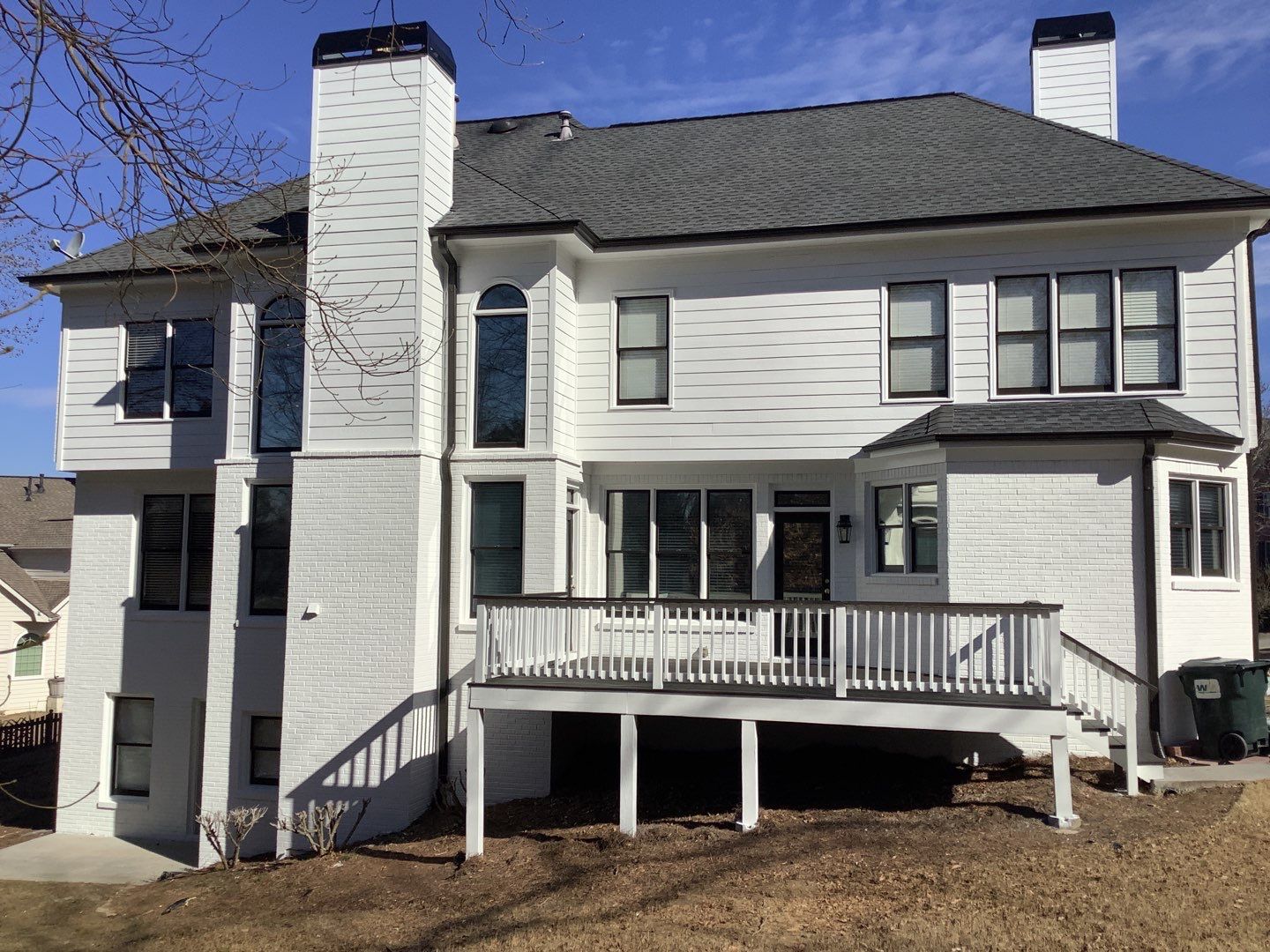 White Brick Exterior Painting and Deck Refinishing in Duluth by Swift Home Renovations