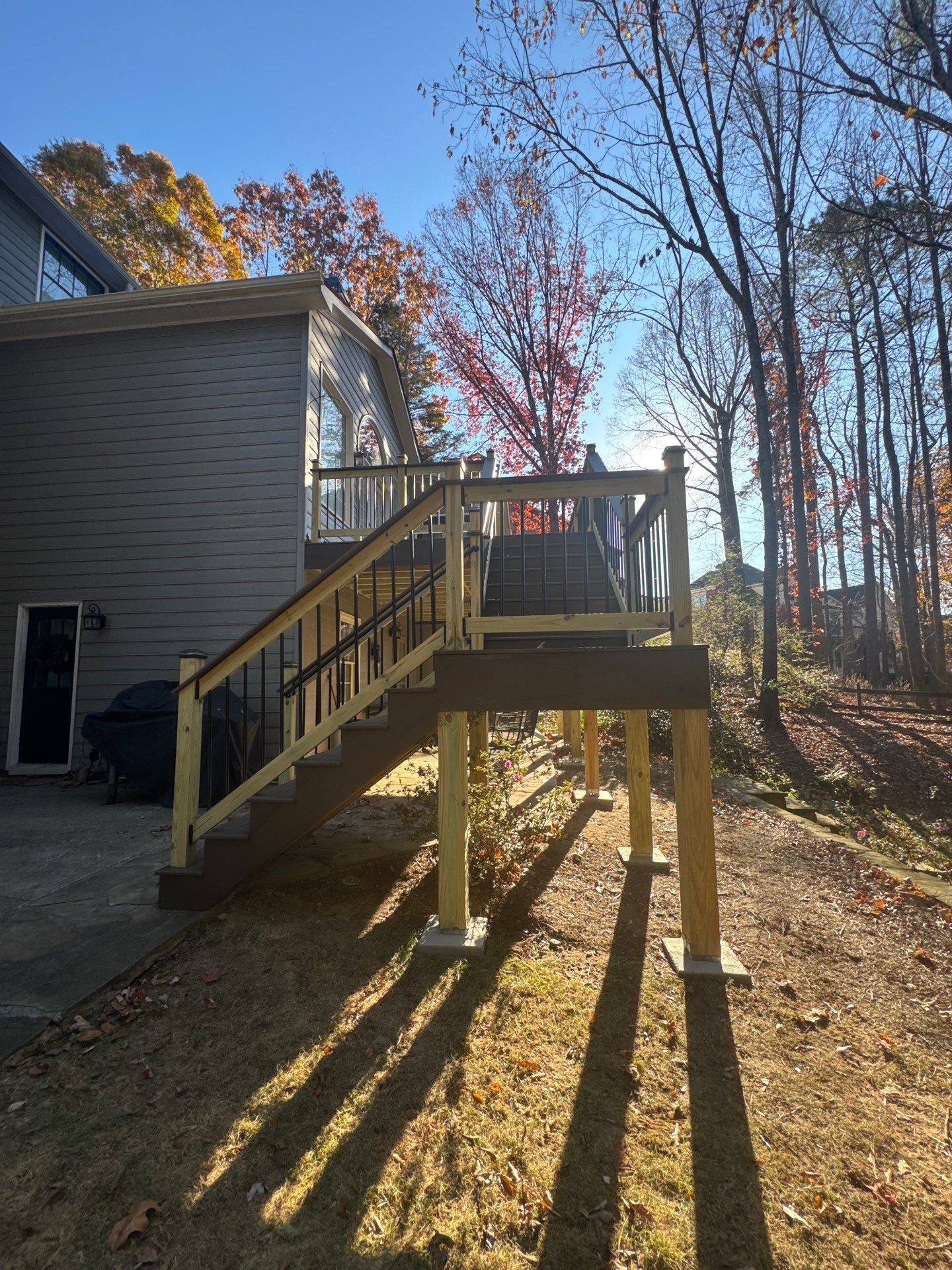 Custom Multi-Level Composite Deck and Sunroom Addition in Suwanee by Swift Home Renovations 