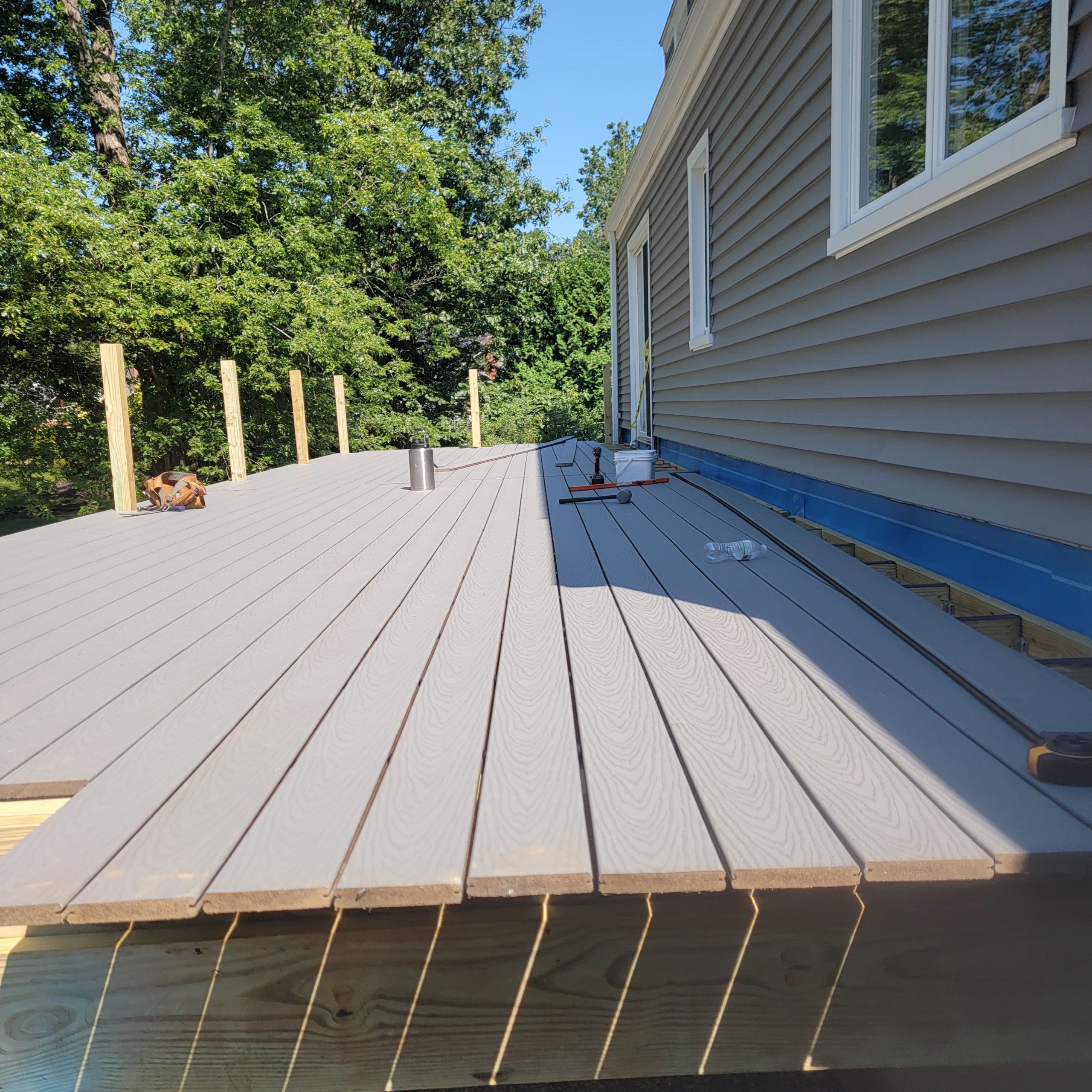 Deck replacement using Trex Select Pebble Gray and transcend White railing. by DiGiorgi Roofing and Siding Inc