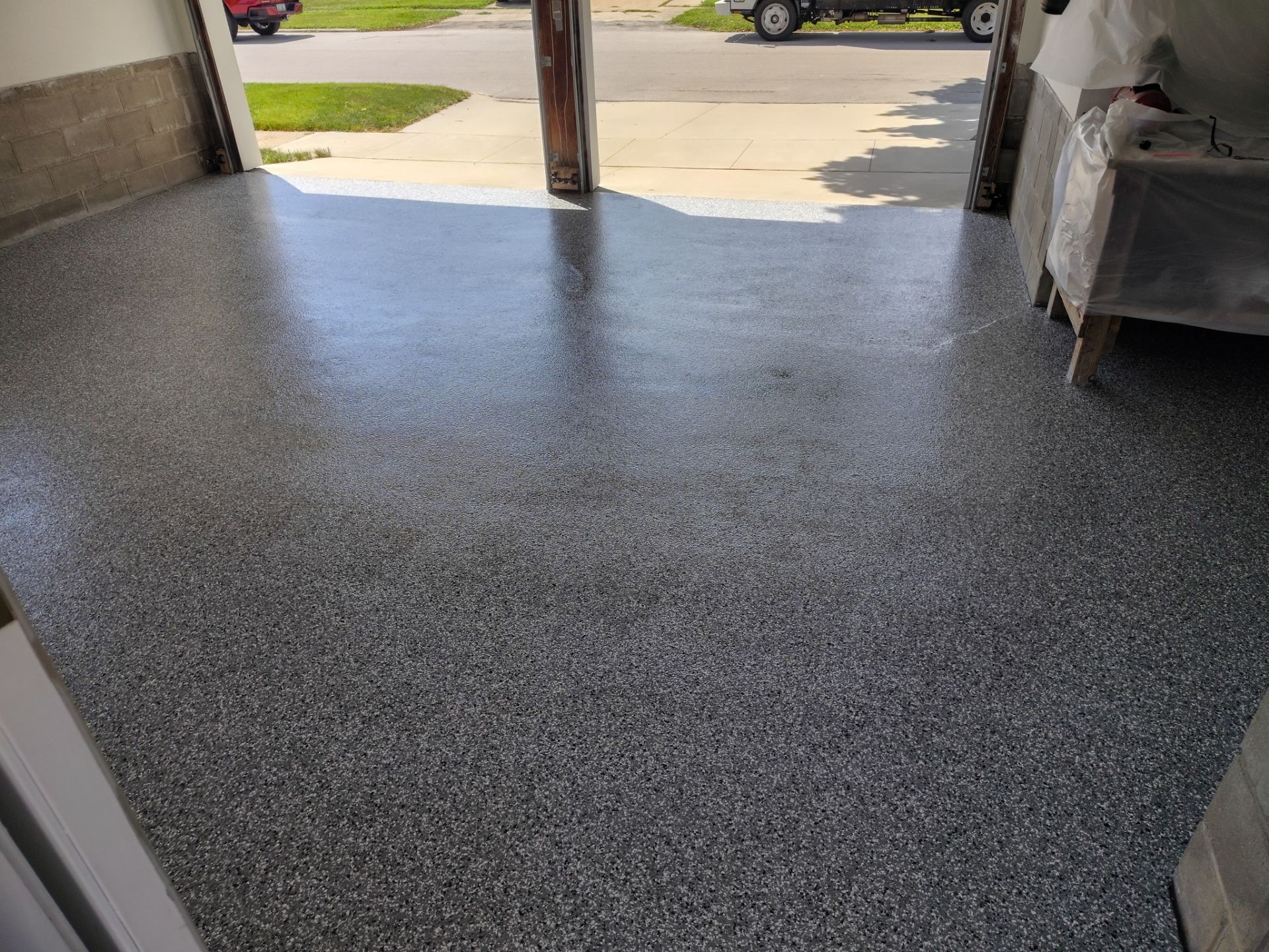 Wombat Flake Garage Floor Coating in Perry, IA by Revival Concrete Coatings