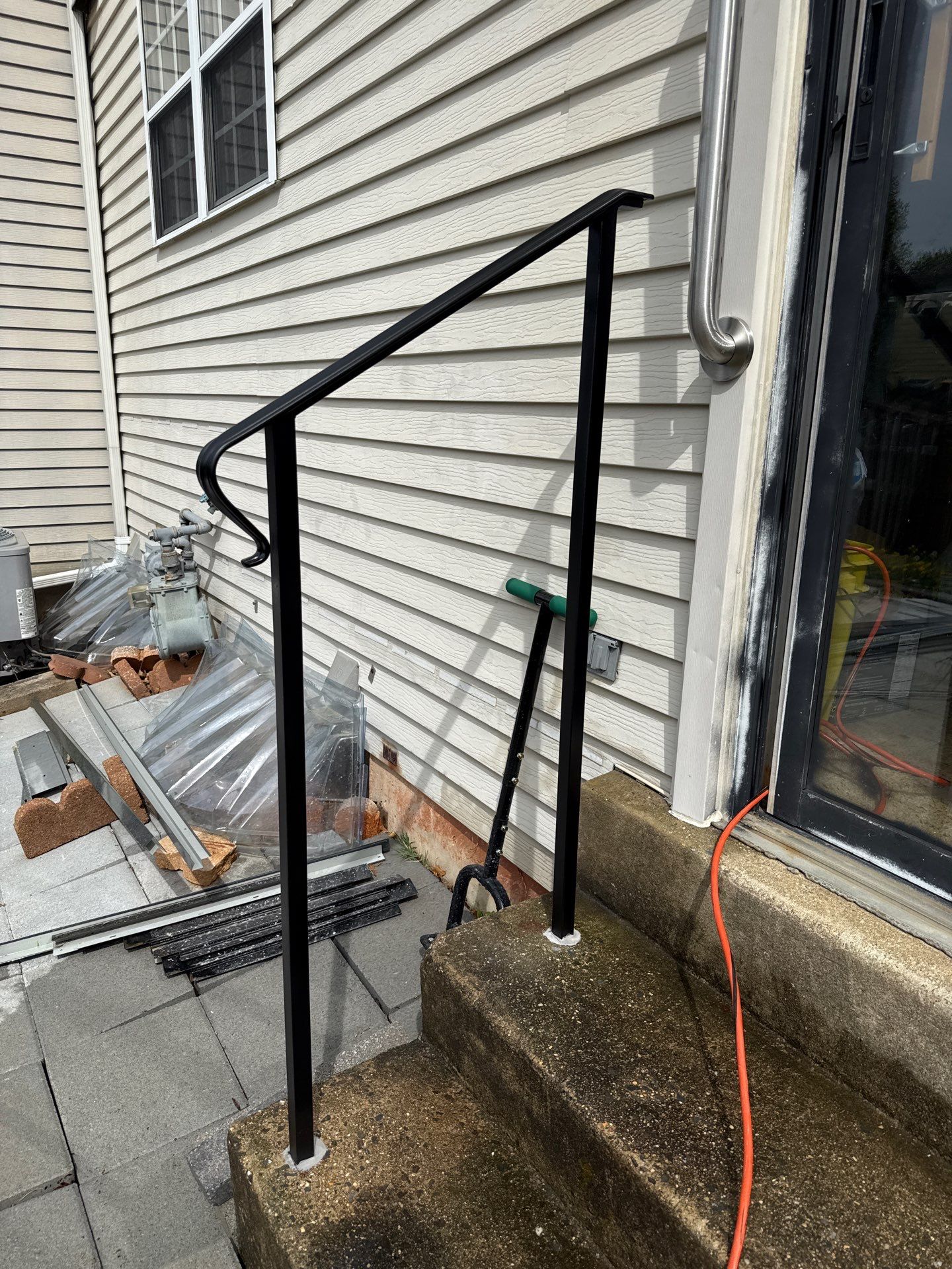 Custom Black Metal Exterior Handrail Installation in Olney by Capitol Iron Works