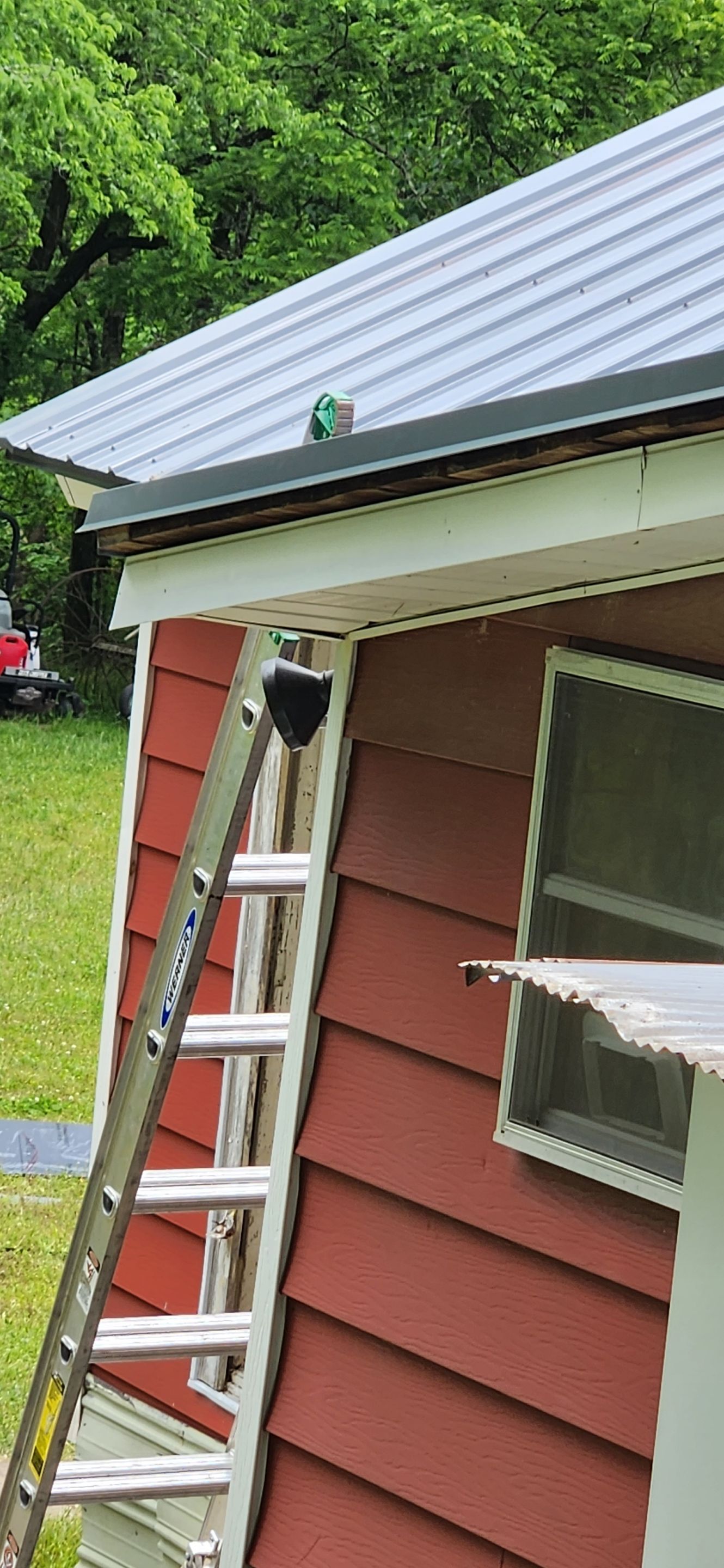 Residential Roofing Installation using 26 Gauge Colored Panels by Hostetler Roofing