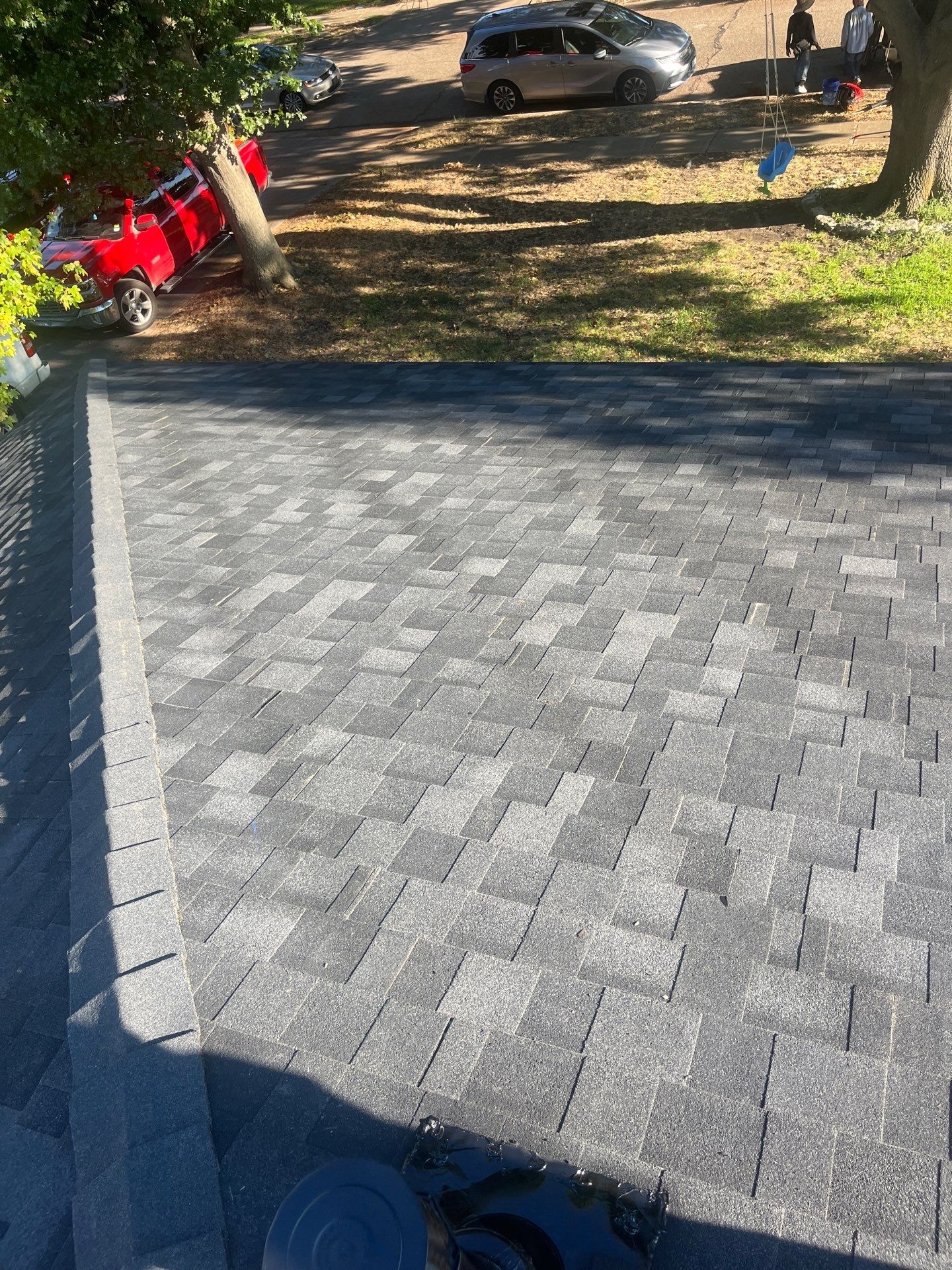 White brick/light gray shutters with IKO Granite Black  by Tejas Roofworks + Restoration