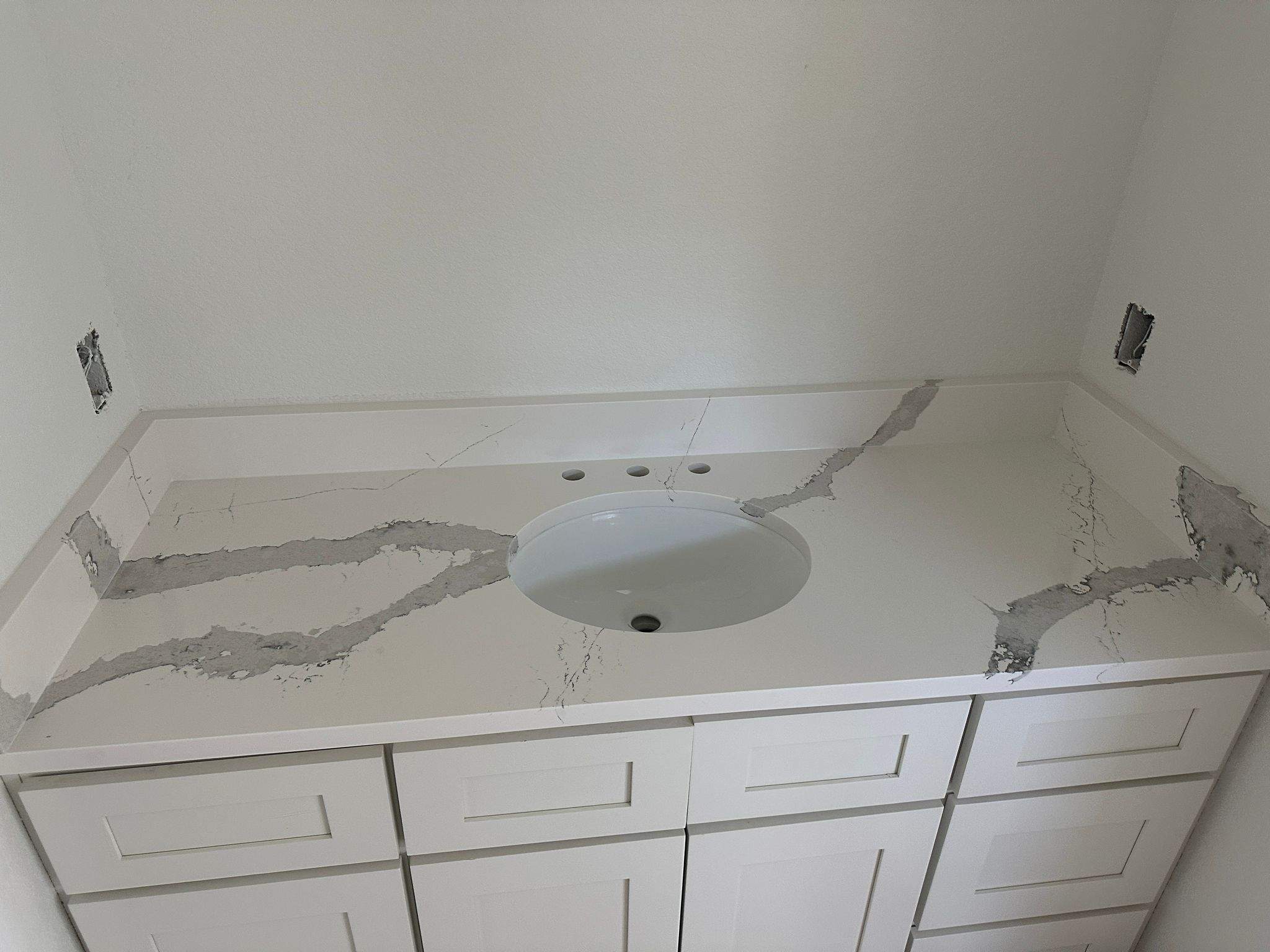 Kitchen and Bathroom Countertop Upgrades Featuring Gray Veined Quartz by Mena stone surfaces