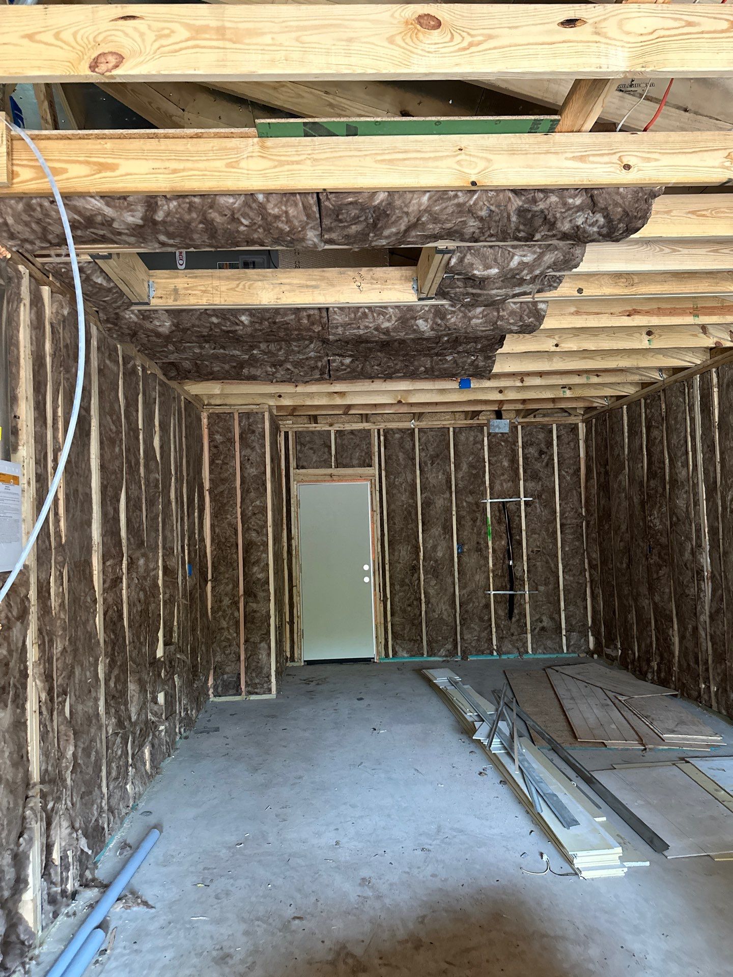 Batt install on Dallas home garage addition with a living suite.  by Apex Insulation Solutions