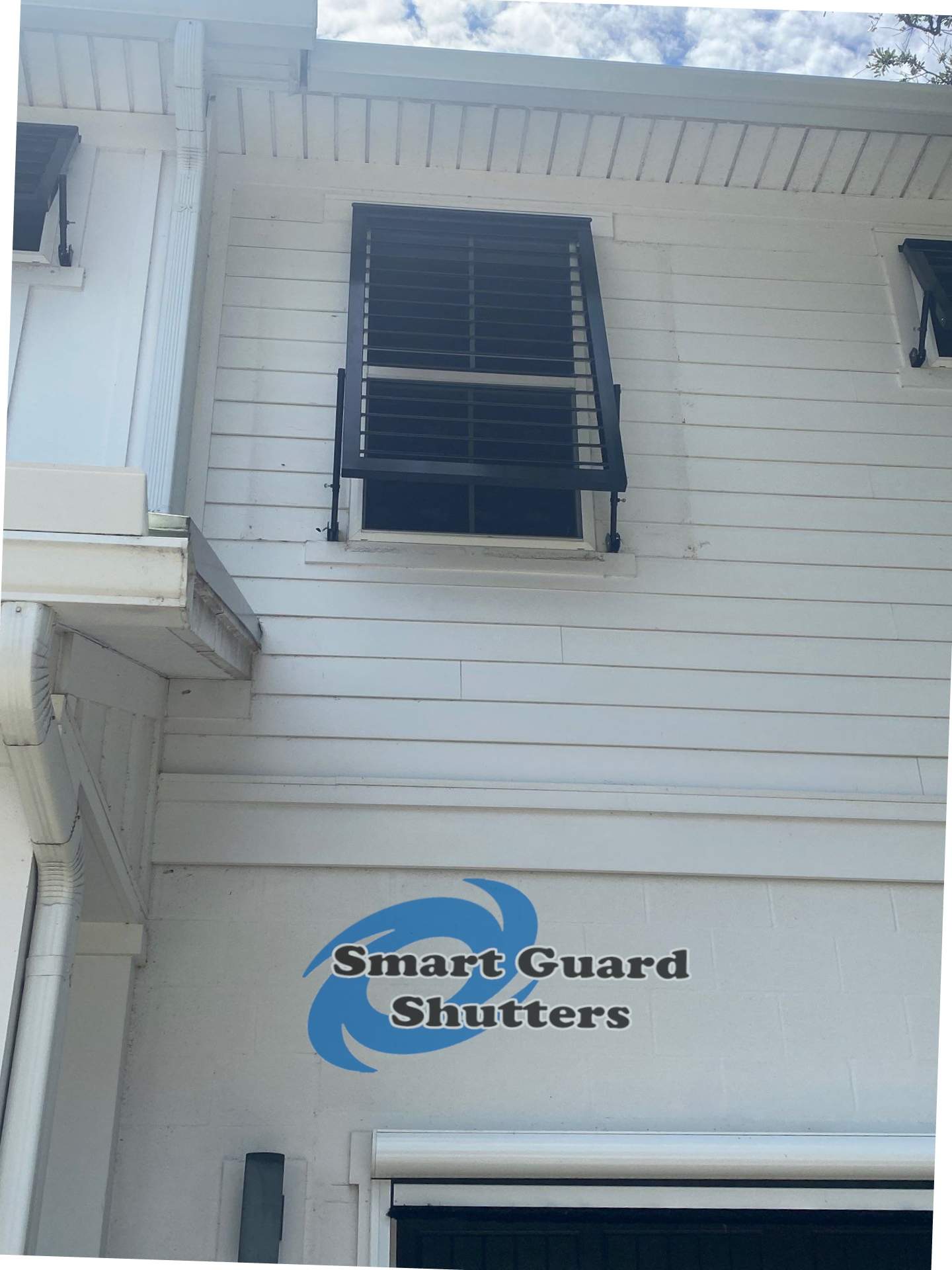 Impact Bahama Shutters in Jet Black by Smart Guard Shutters
