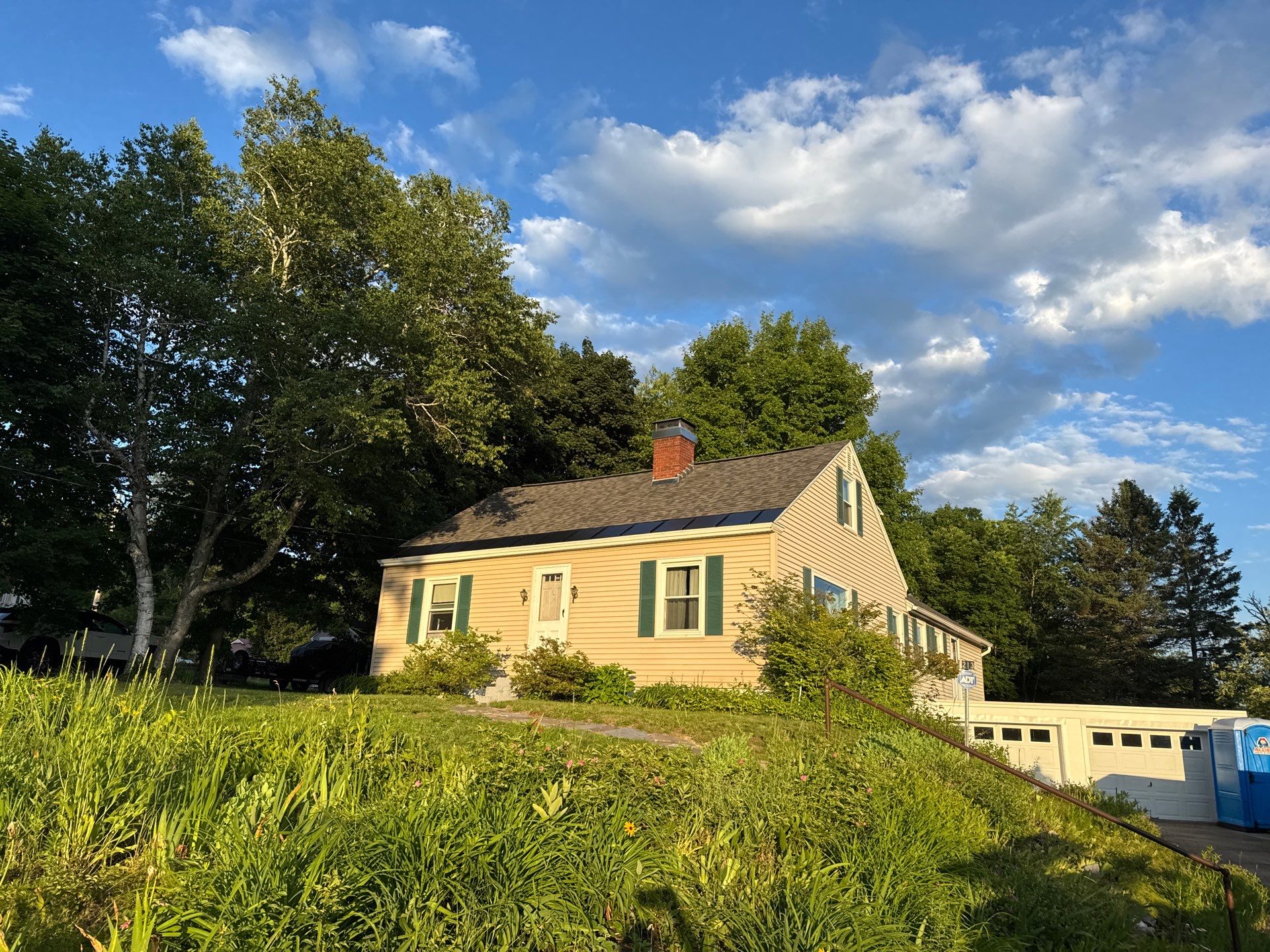 Hybrid Roof Replacement in Pembroke, NH with Owens Corning Peppercorn Shingles, EPDM Rubber Roofing, and Black Metal Ice Belt by Compass exteriors
