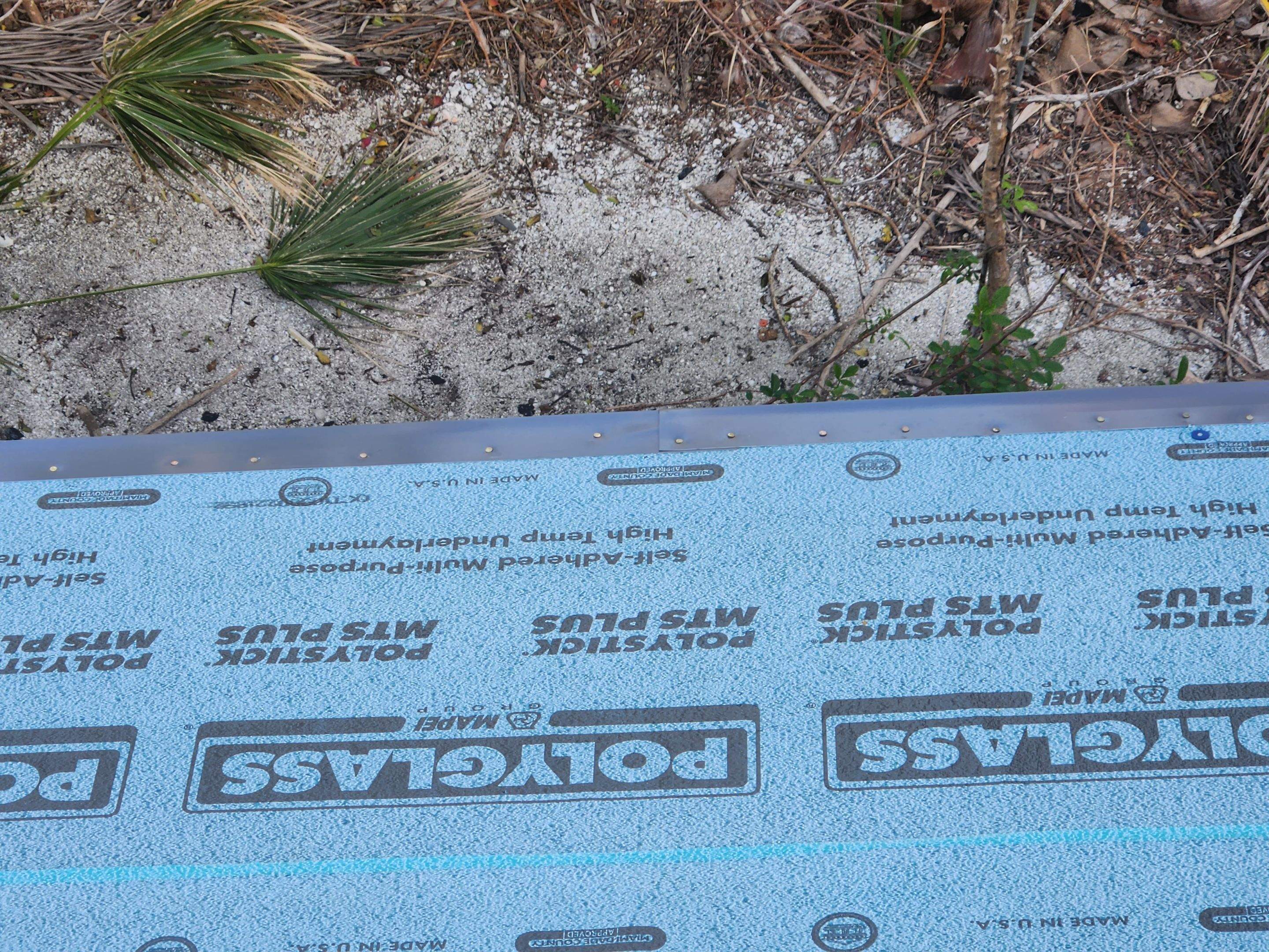 Residential Roofing Installation using Gulf Coast Metals Gulf Seam Panels by Four Peaks Roofing