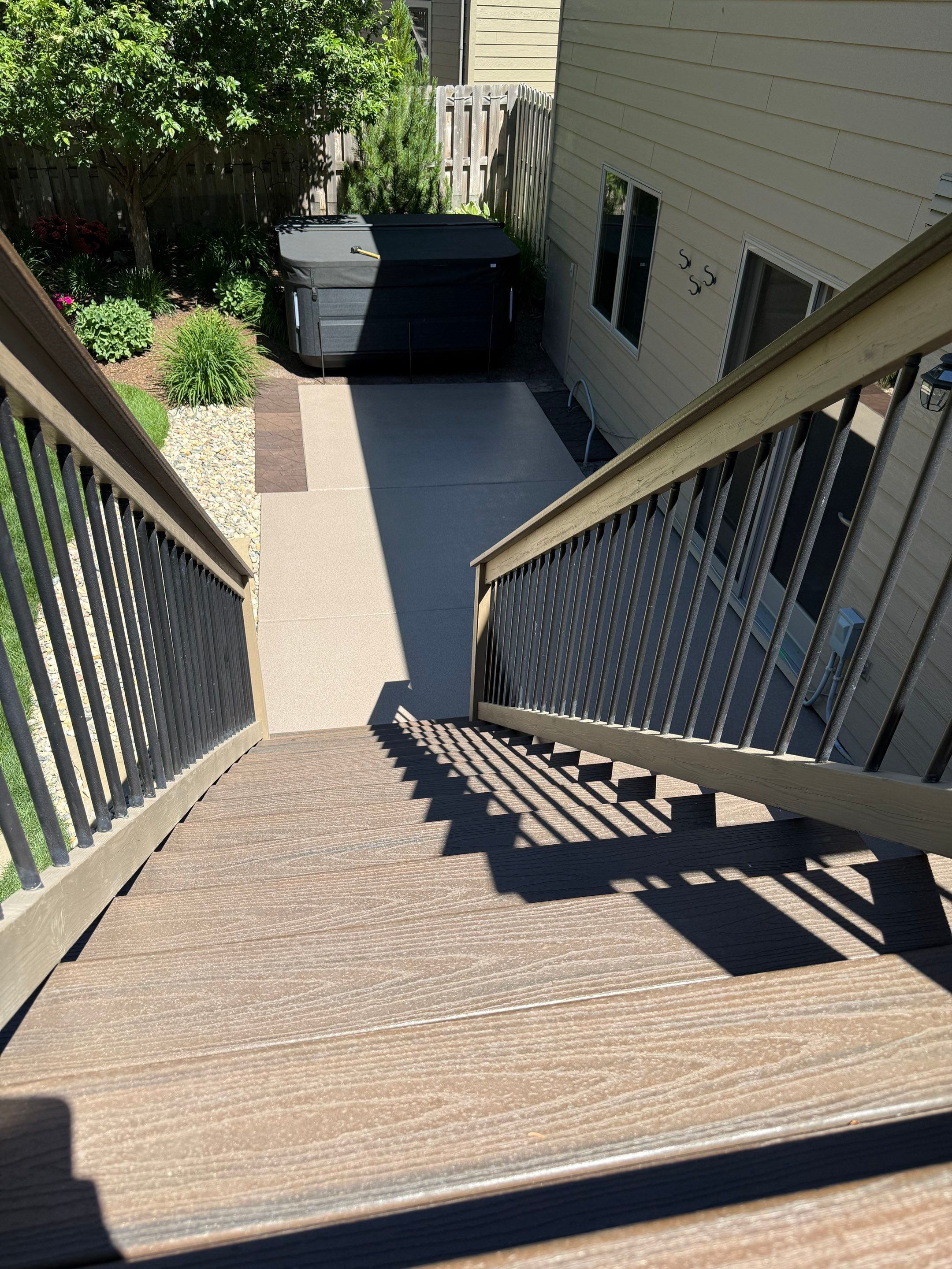 Textured Concrete Coating and Paver Patio Refresh in Sioux Falls by Select Painting, Coatings & Garage Cabinets