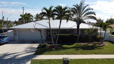 Residential Roofing Installation using 1" Nail strip metal roof