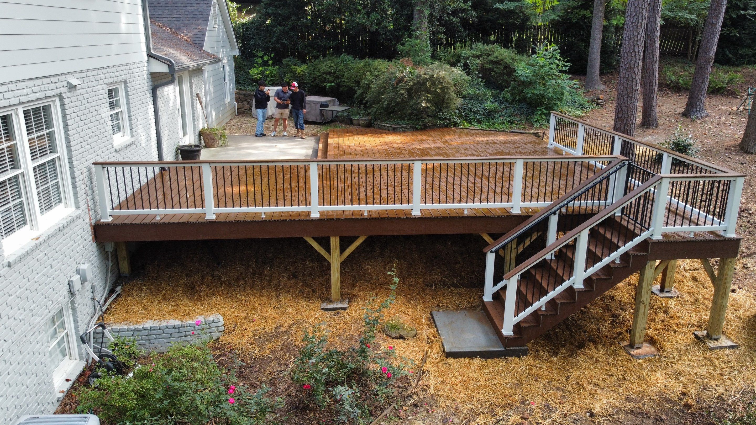 Custom Stained Wood Deck Installation with White Railings in Atlanta by Swift Home Renovations