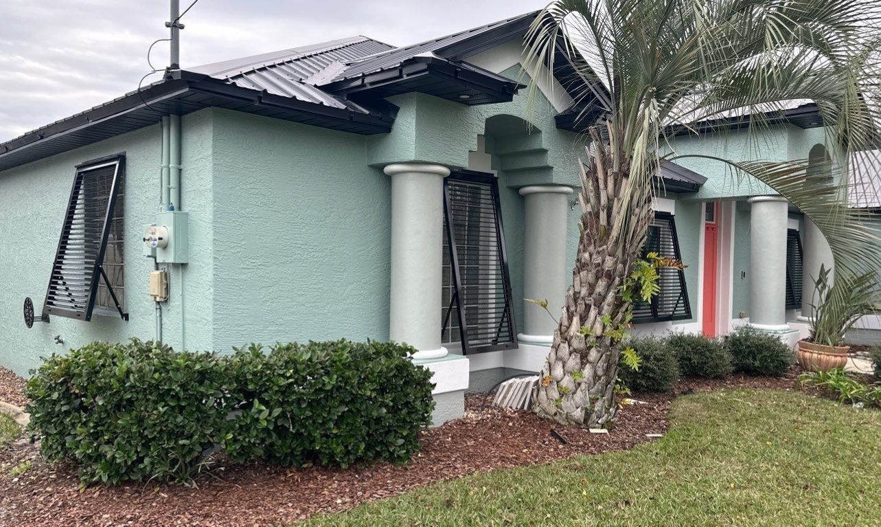 Bahama Shutters in Jet Black by Smart Guard Shutters