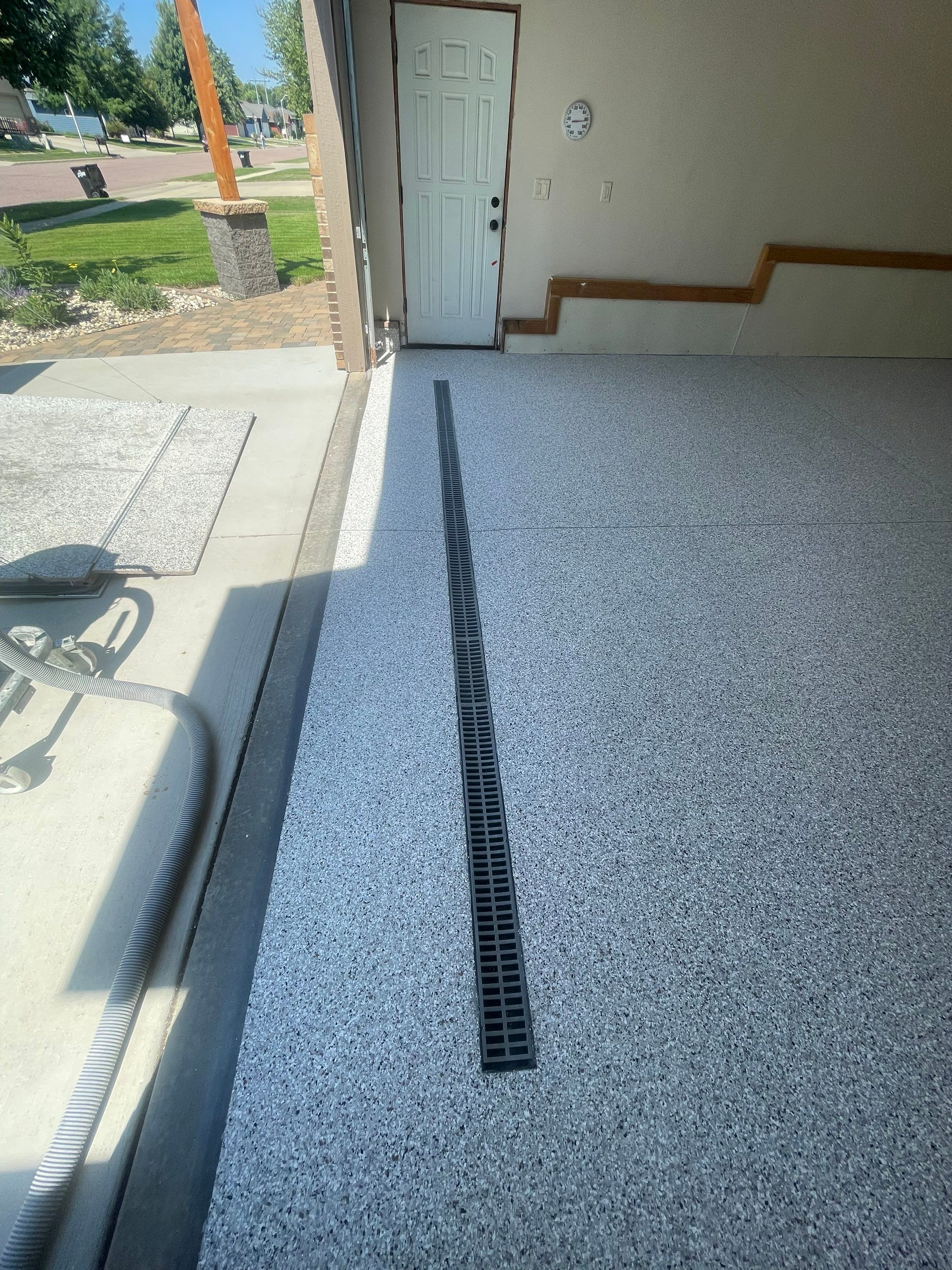Multi-Stall Garage Floor Coating Installation in Sioux Falls by Select Painting, Coatings & Garage Cabinets