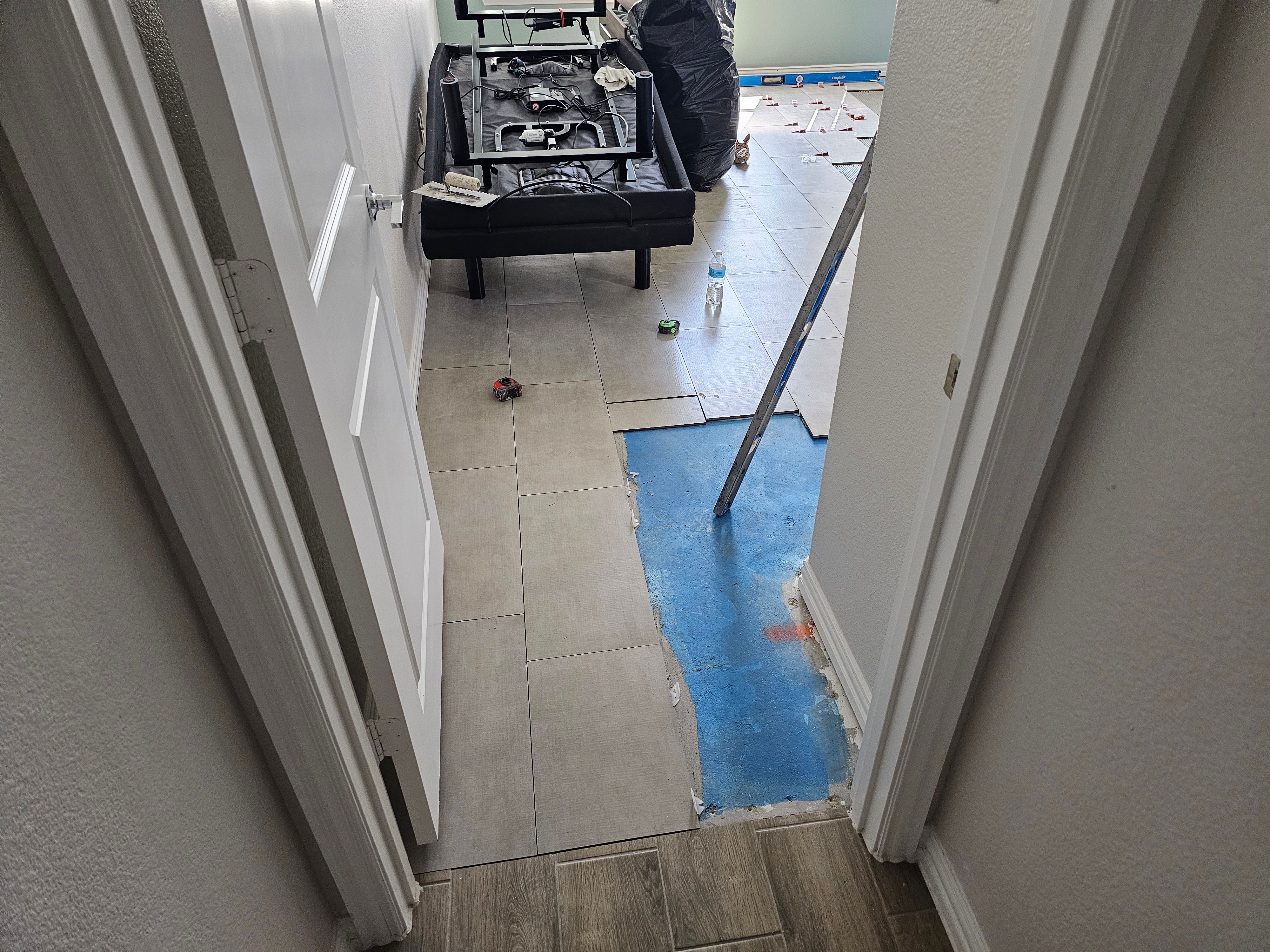 Carpet replacement with Tile and Red Oak Stairs by EL-GC LLC 