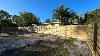 Wood Fence Installation using Horizontal Shadowbox Wood Privacy Fence