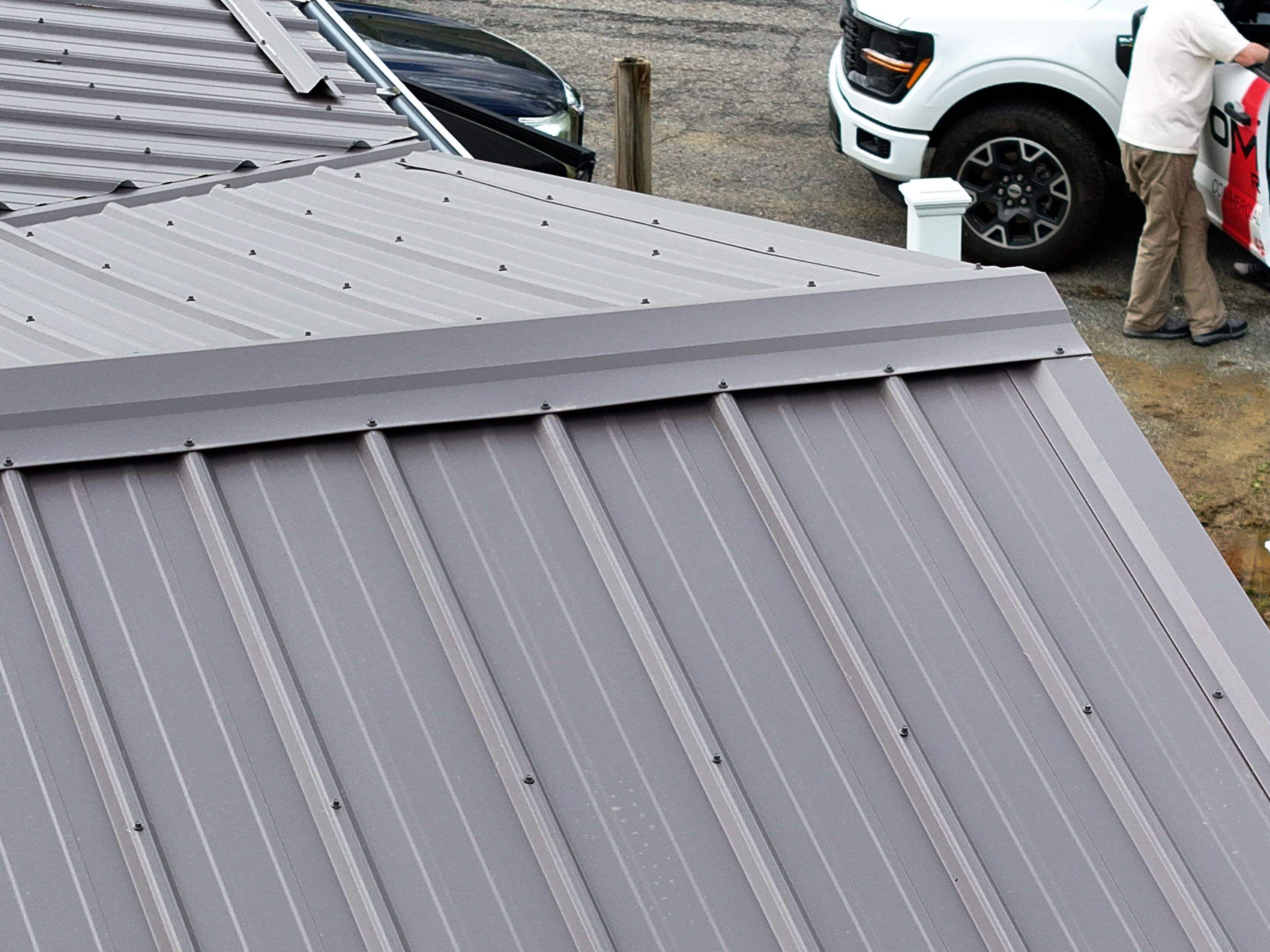 Charcoal Gray Textured Metal Roof by Omnia Roofing