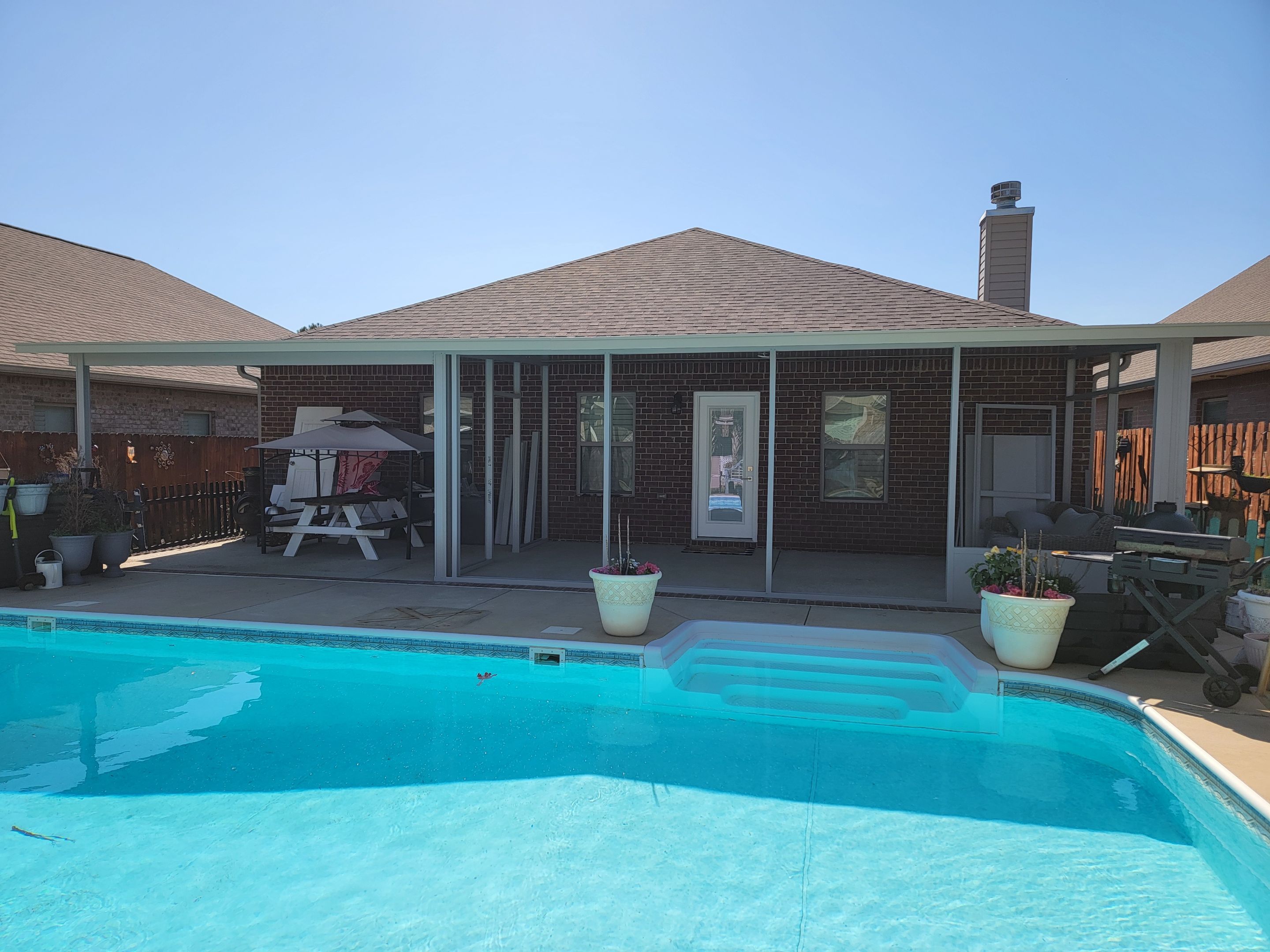 Poolside Screen Room & Patio Cover in Gulf Breeze by Titan Sunrooms