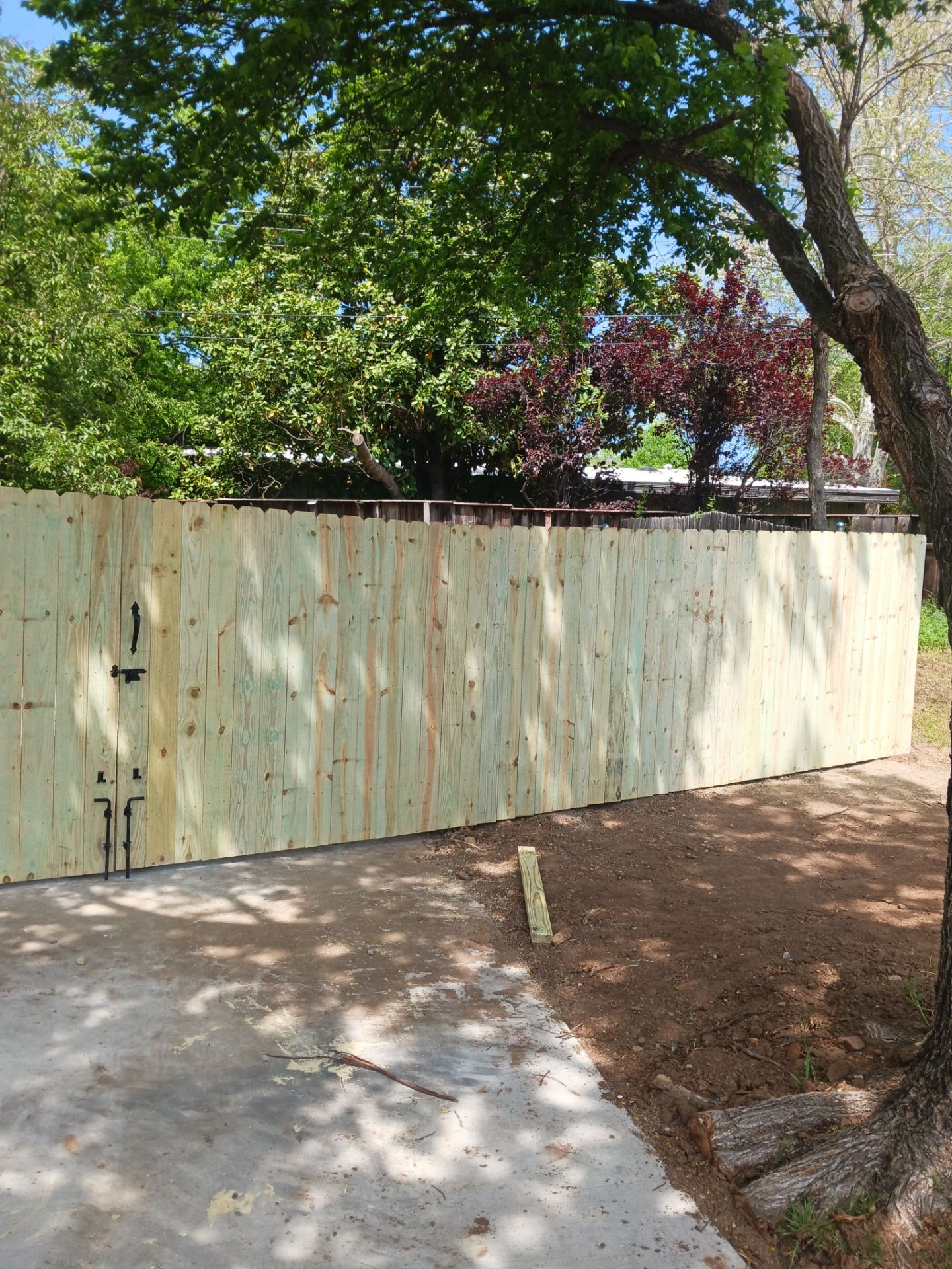 Concrete Driveway and Fence by Clays Services Inc