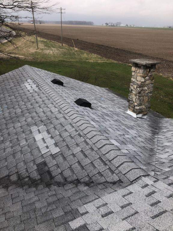 Storm damage roof replacement by Nitro Roofing and Construction