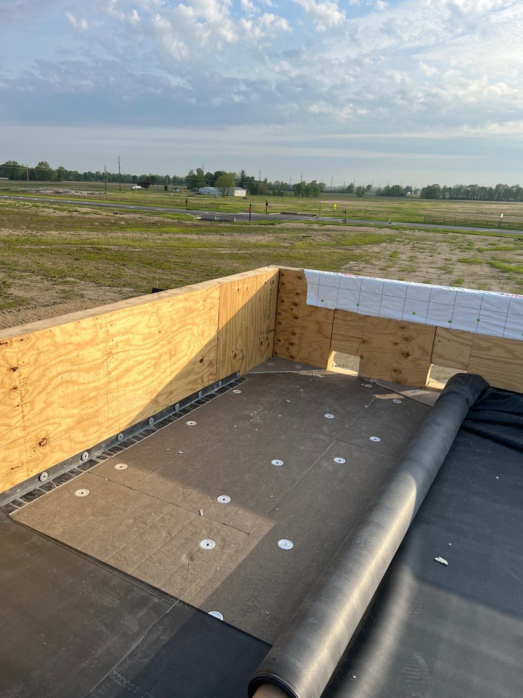 Commercial Roofing Installation using 60 mil rubber roof  by Nitro Roofing and Construction