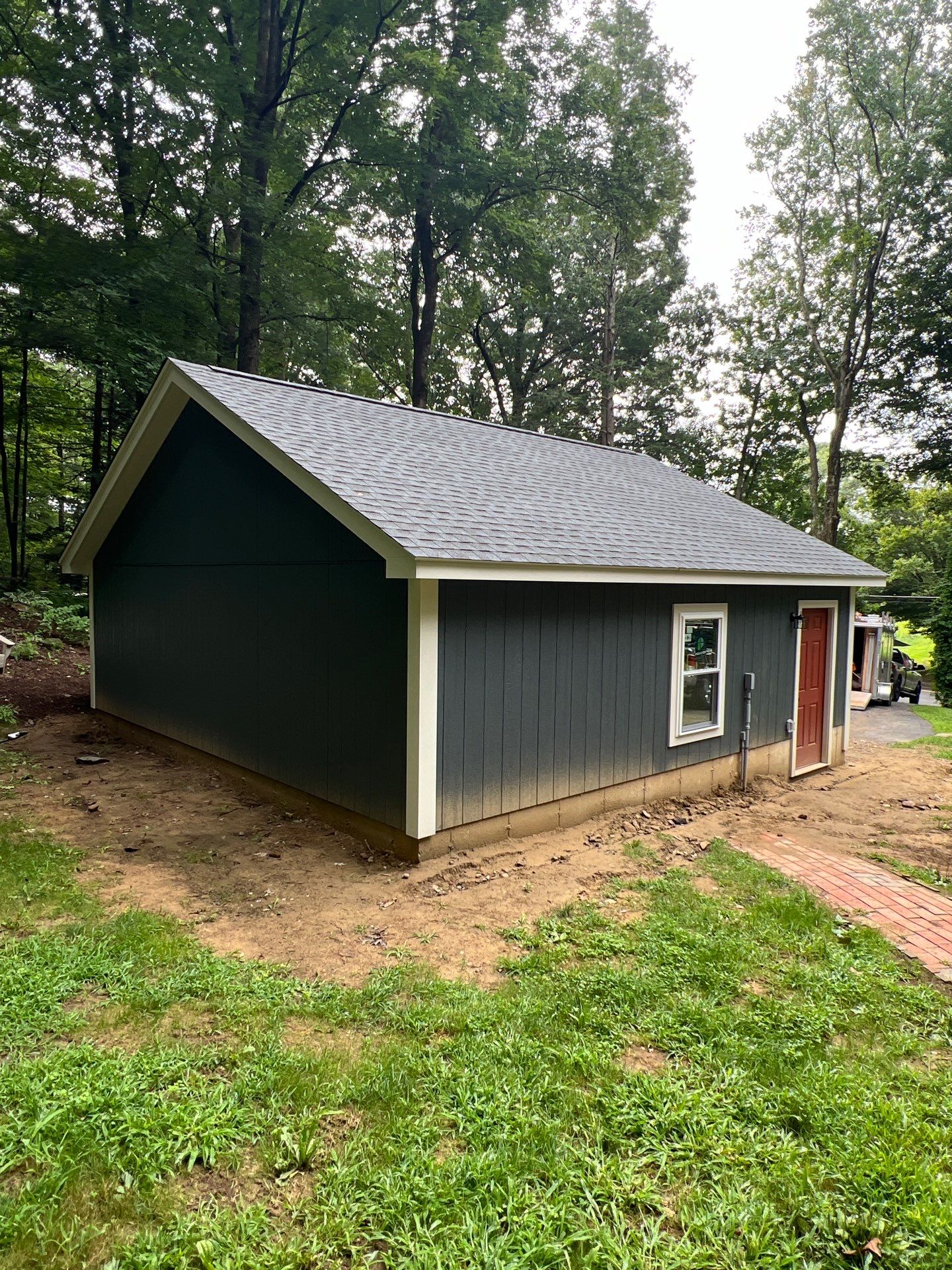 Garage using LP SmartSide Panel Siding by Chagnon Building & Remodeling LLC