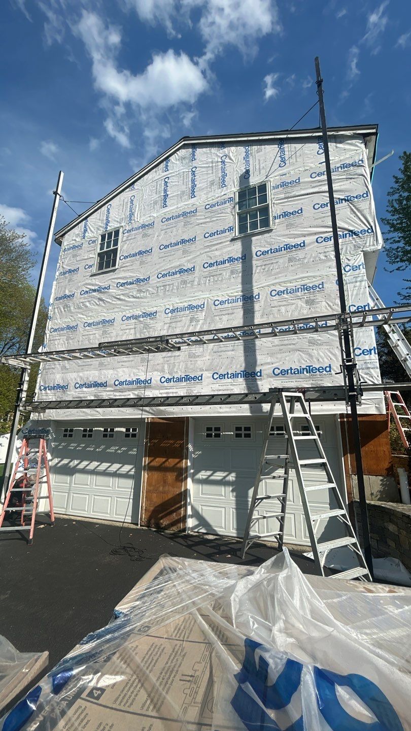 Siding update with Cert Cedar Impressions D/7 perfection straight bottom, White & Cert. Monogram D/4 x 25' clapboard, White by DiGiorgi Roofing and Siding Inc