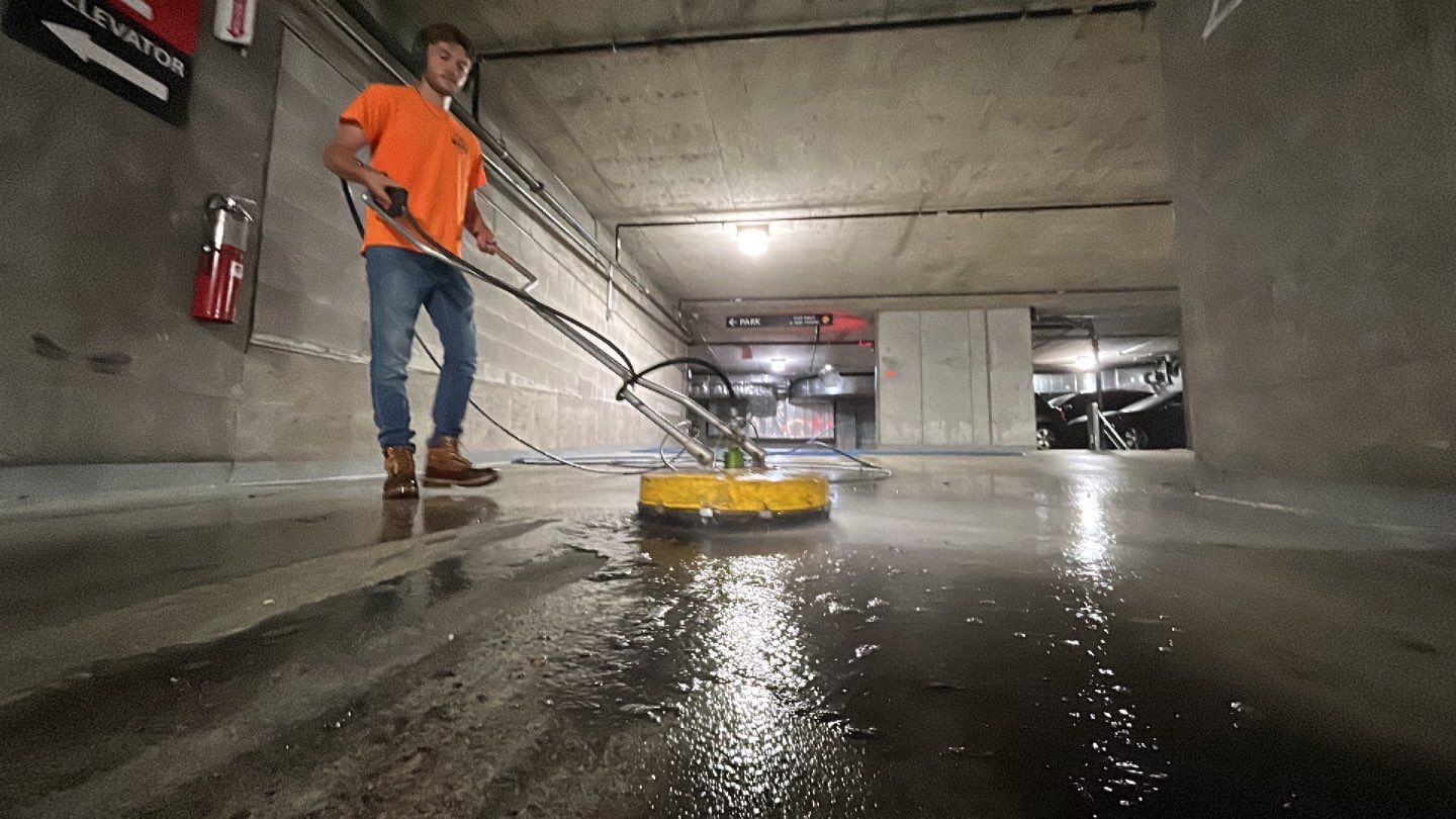 Parking garage using Hot water by Northern Power Washing LLC.