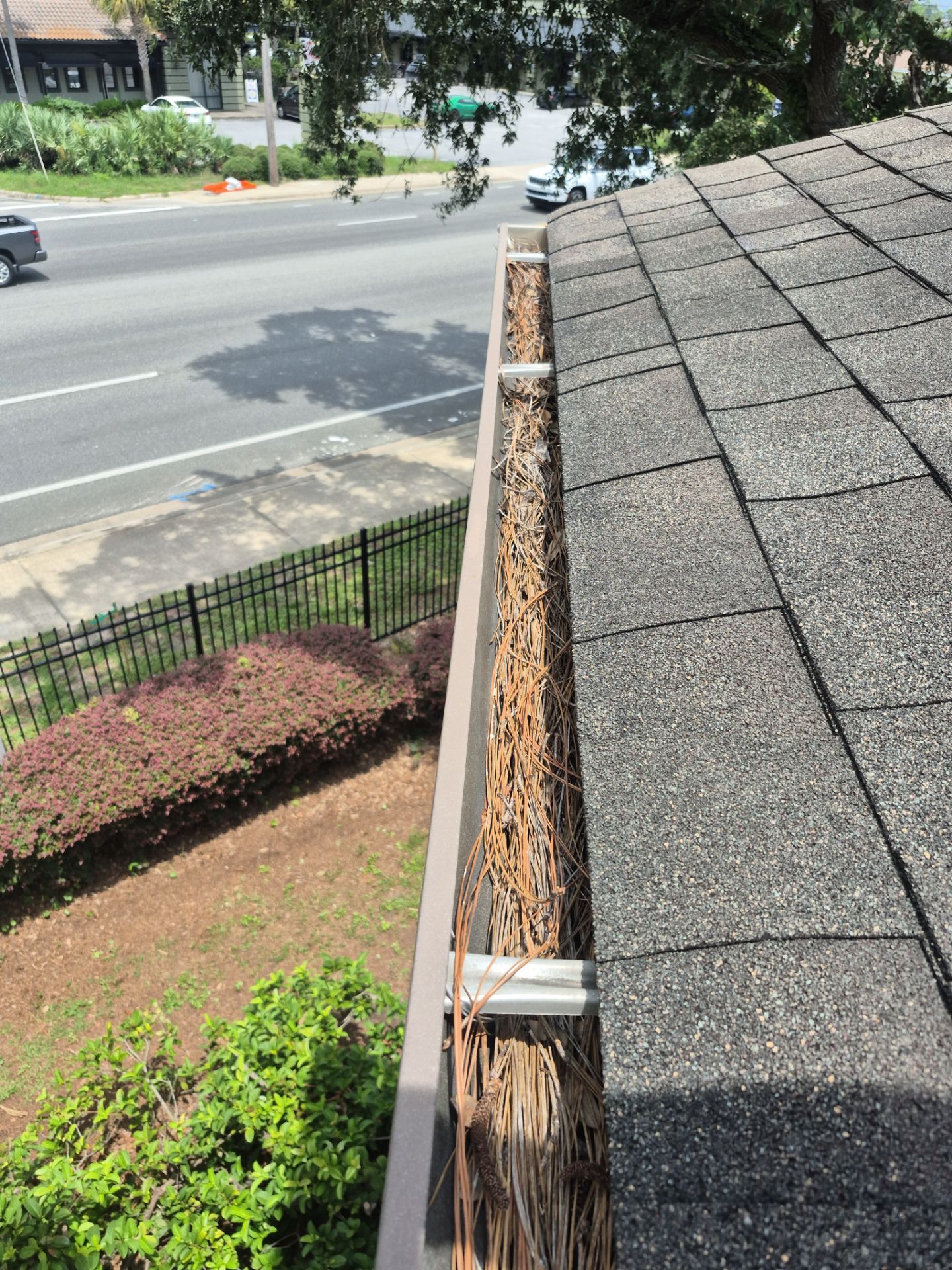 HOA gutter cleaning in Pinehurst & Southern Pines, NC,before  photo showing full gutters.