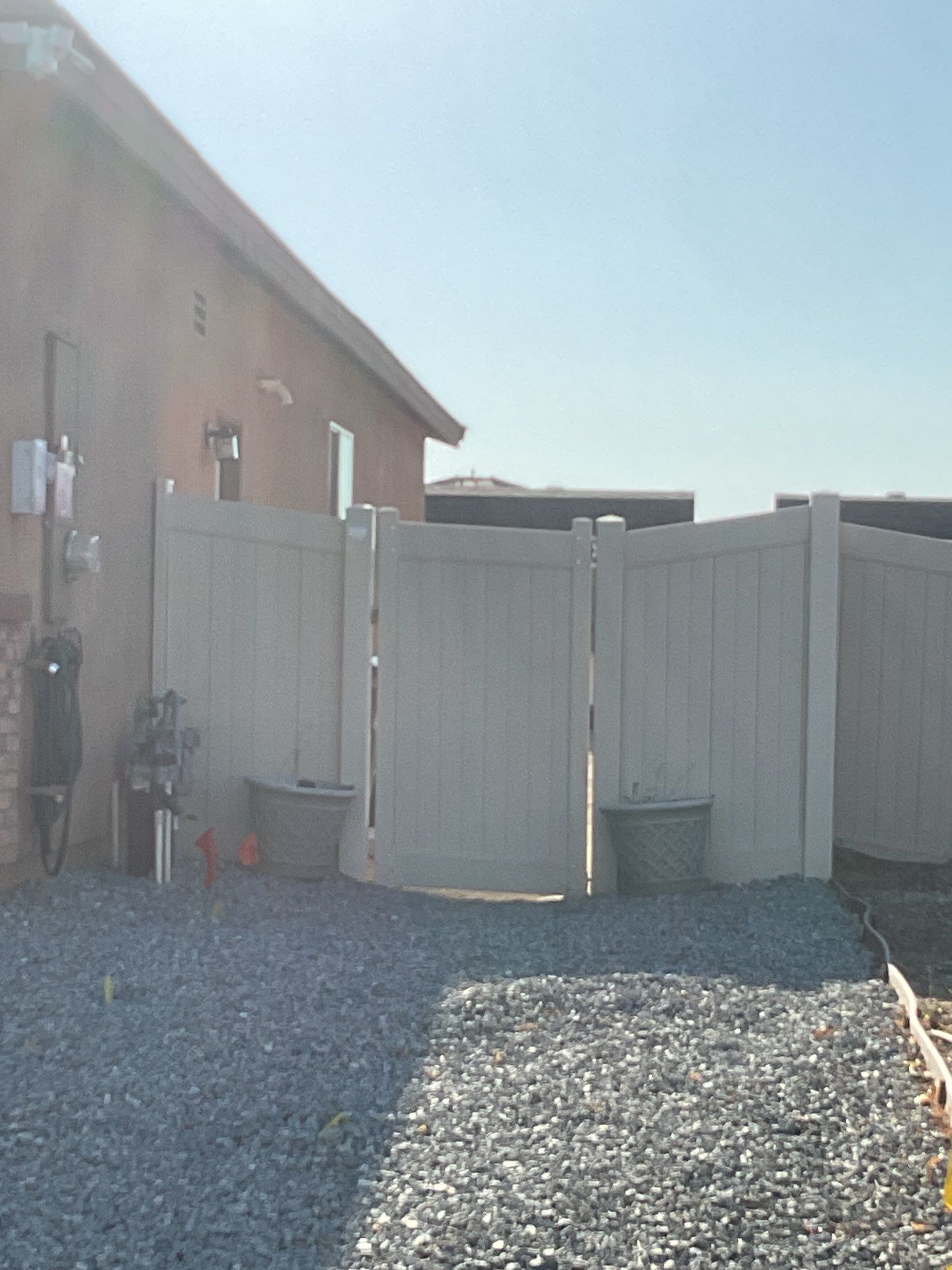 Gate installation using Vinyl by Fence Guys Inc. 