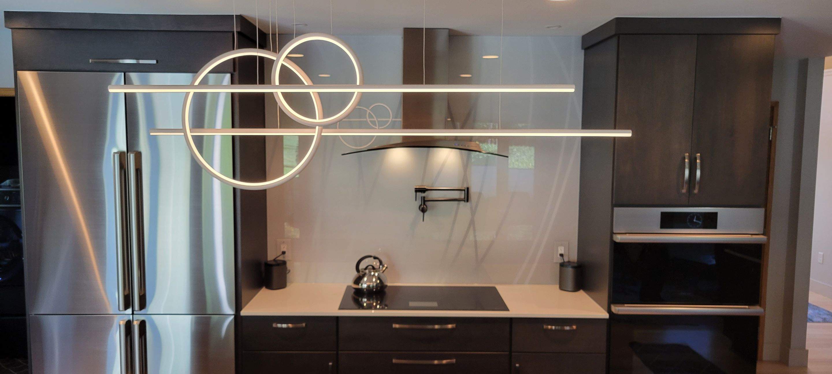 Kitchen Remodel using IMAGIO Misty Curves Solid Glass Backsplash by IMAGIO