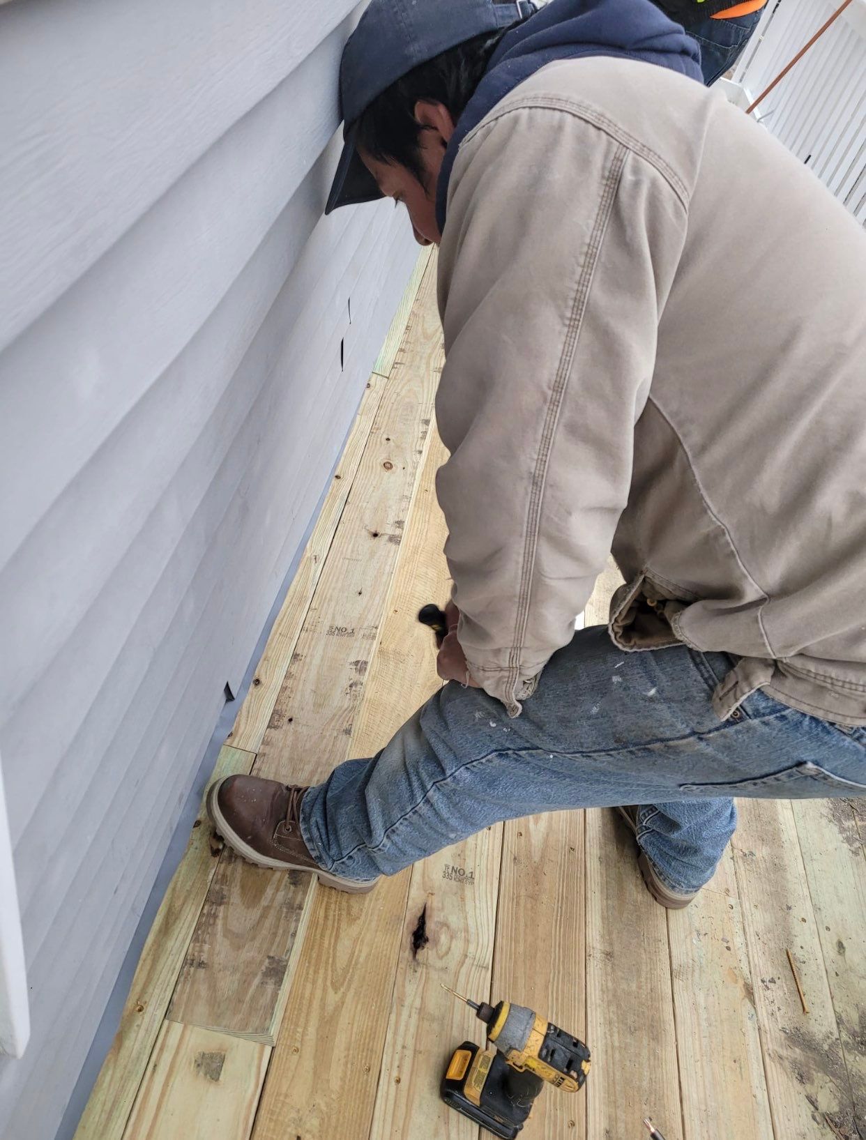 Deck Installation using Pressure treated railing by A Plus Exterior