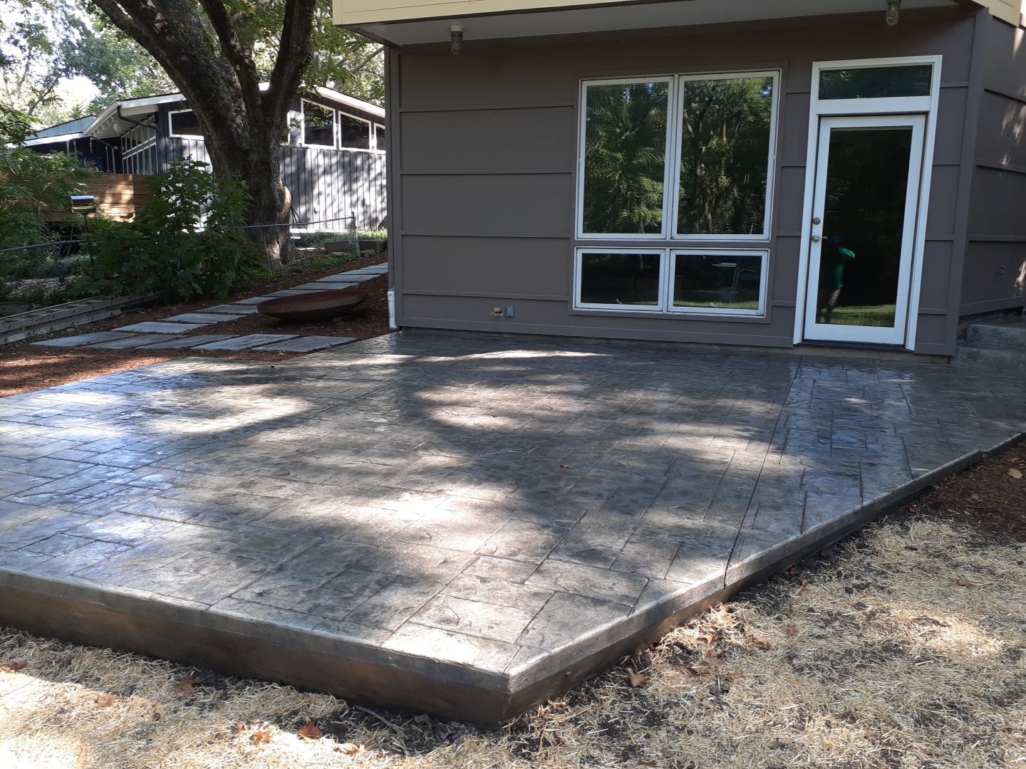 Back Yard Cantilivered Patio by LAND ESCAPES LLC