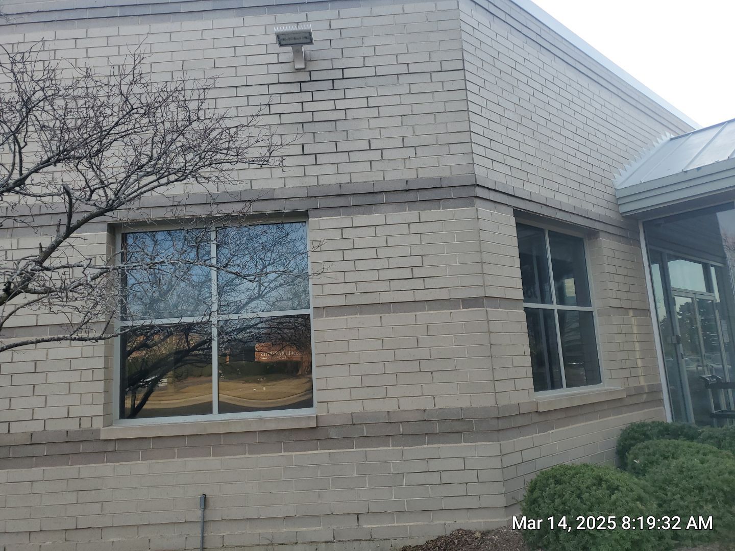 Commercial Facade cleaning using Algaecide, soft wash soap by Northern Power Washing LLC.