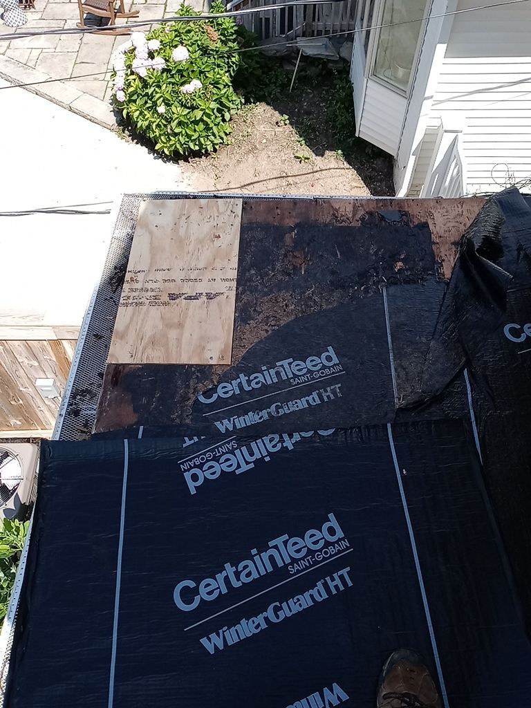 Residential Roofing Installation, Dec-tek walk-out porch roof, siding on garage by Absolute Roofing and Construction
